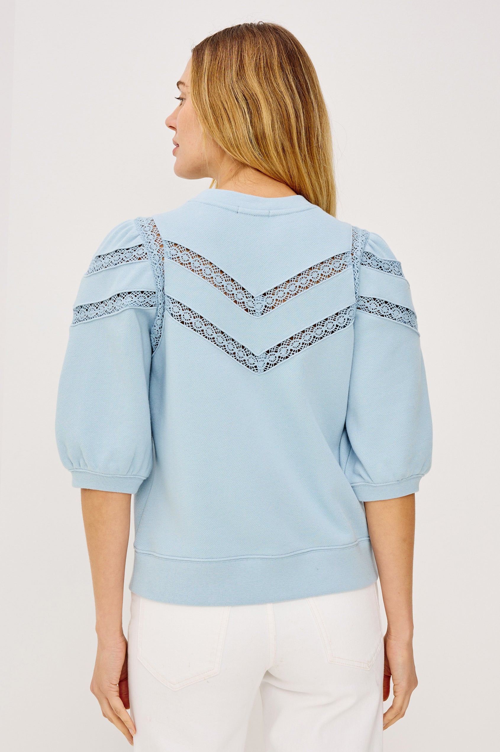 Adria Crewneck Top in French Terry With Sheer Crochet Insets at Front, Back, and Short Puff Sleeves in Sky Colorway - Upper Body Back View Featured on Model
