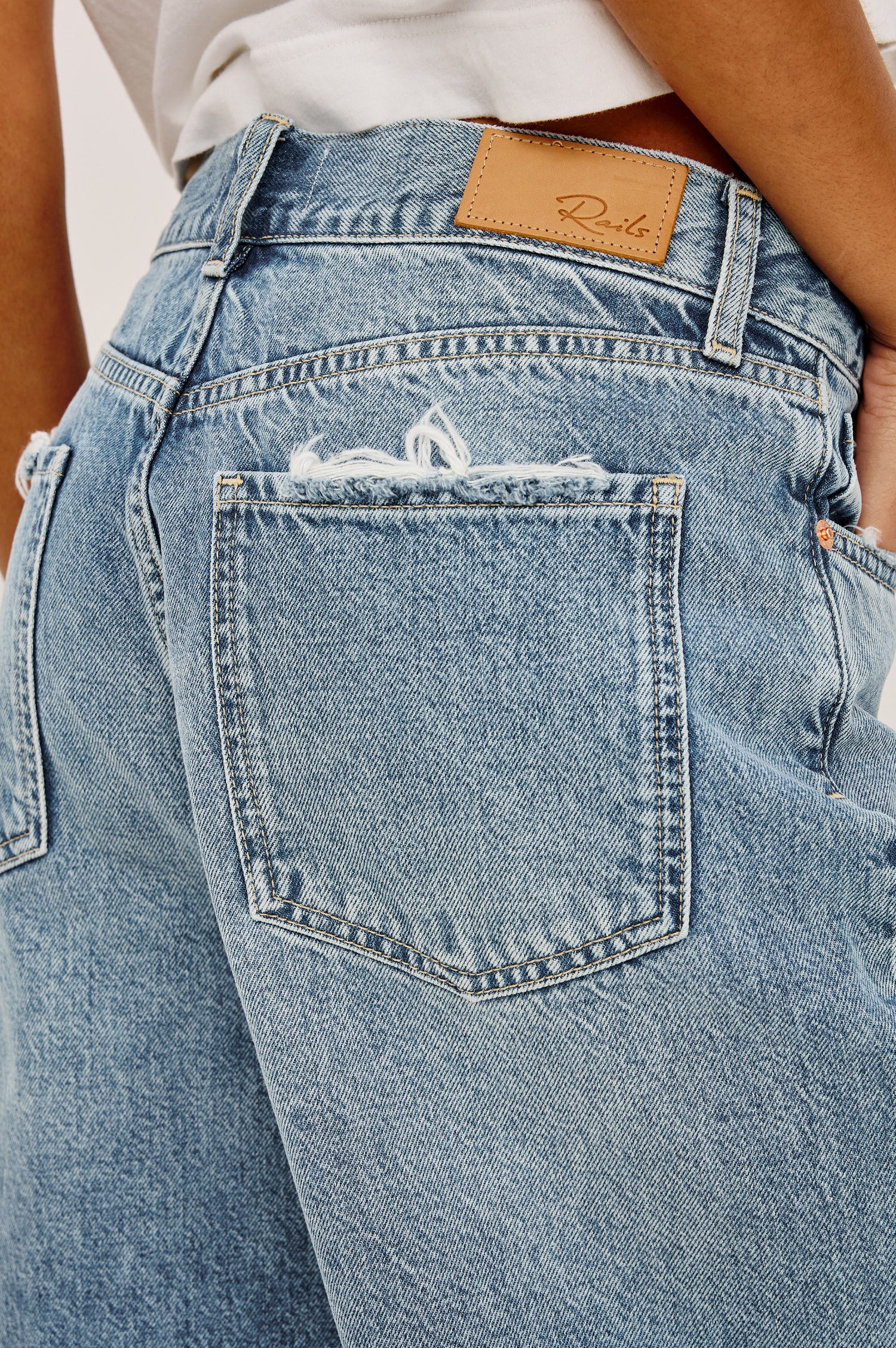 Agoura Short in Rigid Denim With Wide Leg, Relaxed, Low-Slung Fit, Distressed Detailing, Zip Fly, Belt Loops, and 5-Pockets in Authentic Stone Colorway - Lower Body Front View Featured on Model