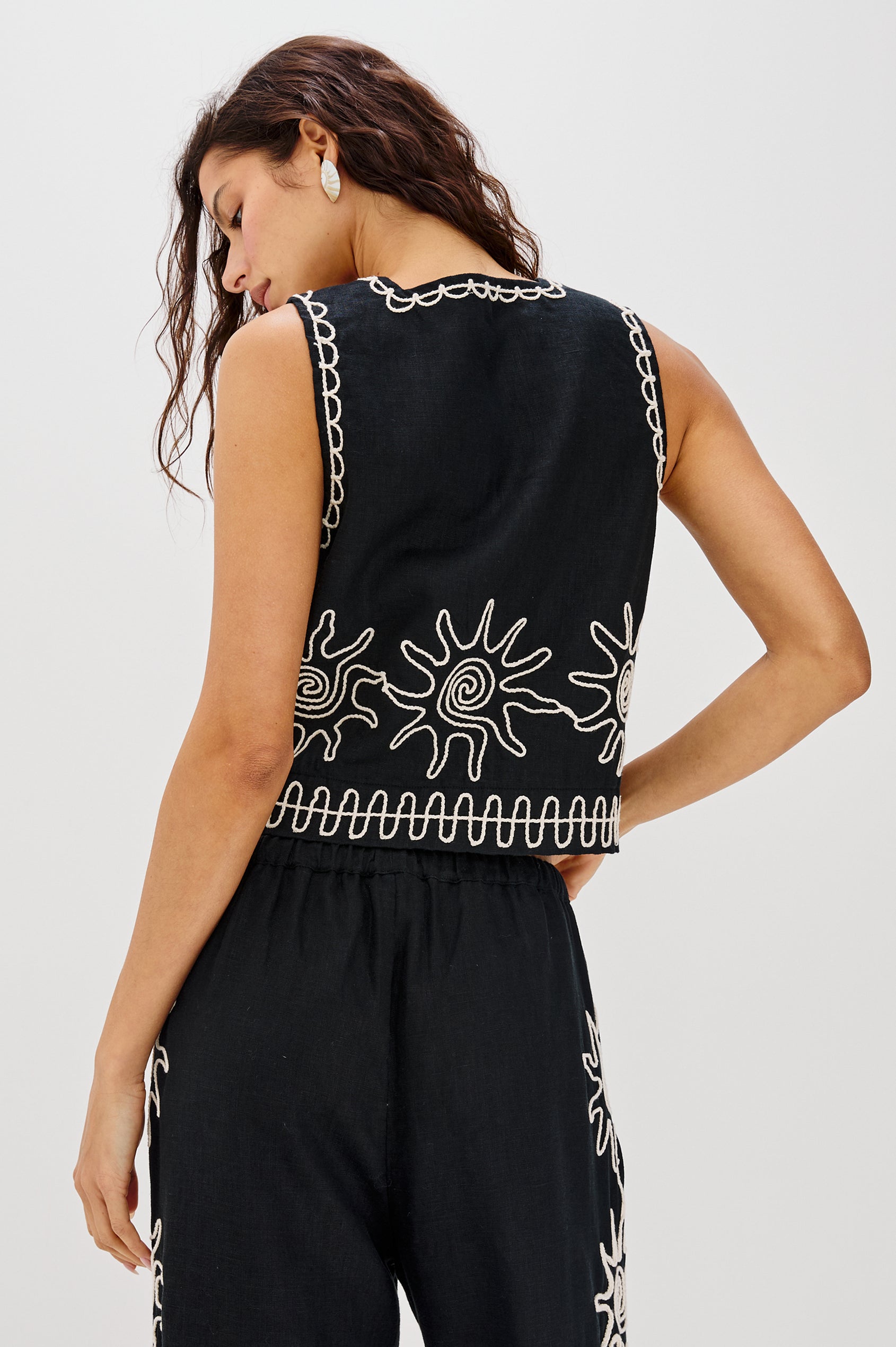 Akira Square Neck Crop Top with Wide Straps in White Contrast Sun Embroidery Colorway. Back View Shown on Model.