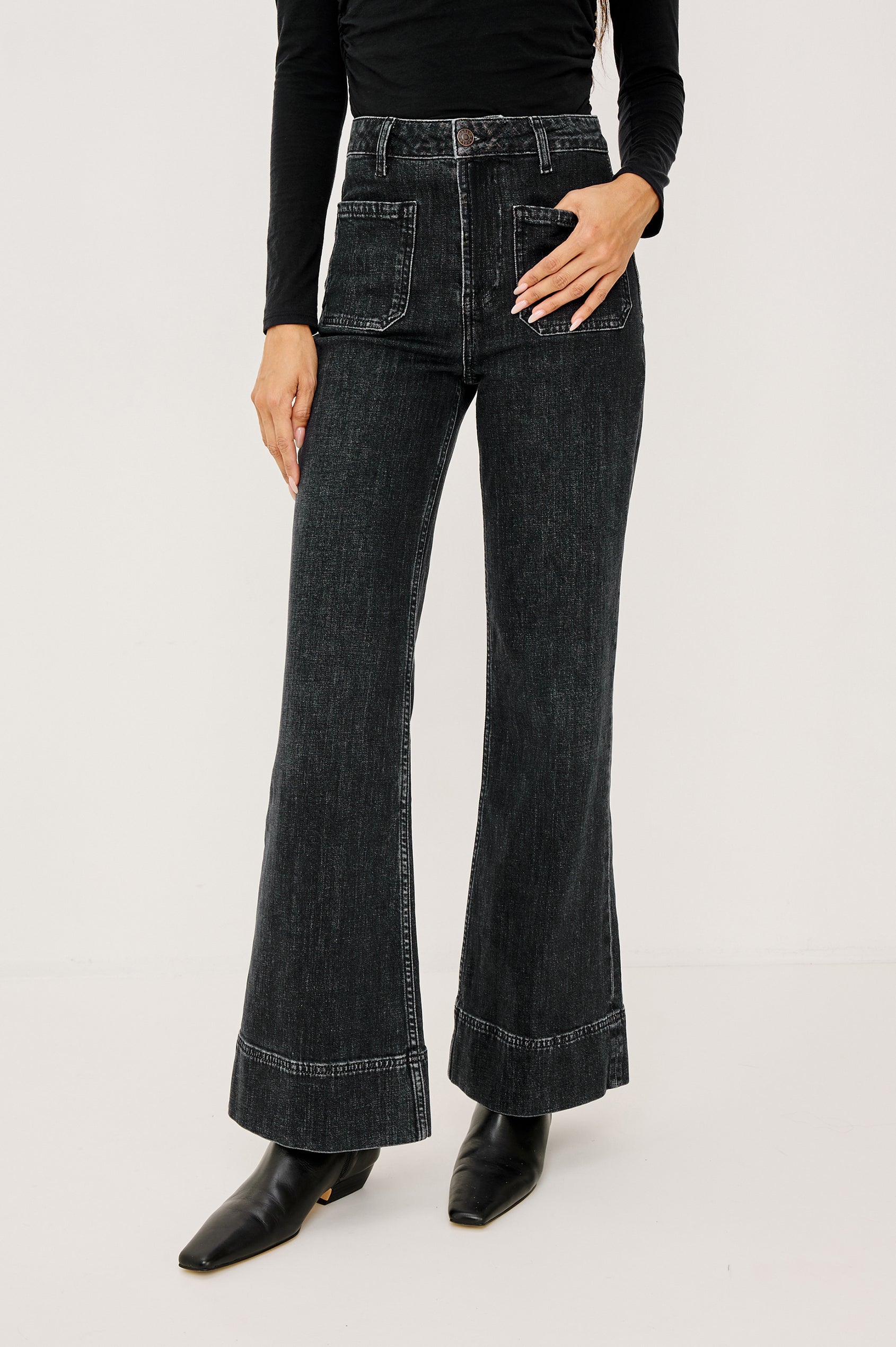 Alamitos high waisted denim trouser with flared leg and front patch pockets in Black Pearl colorway- front view on model.