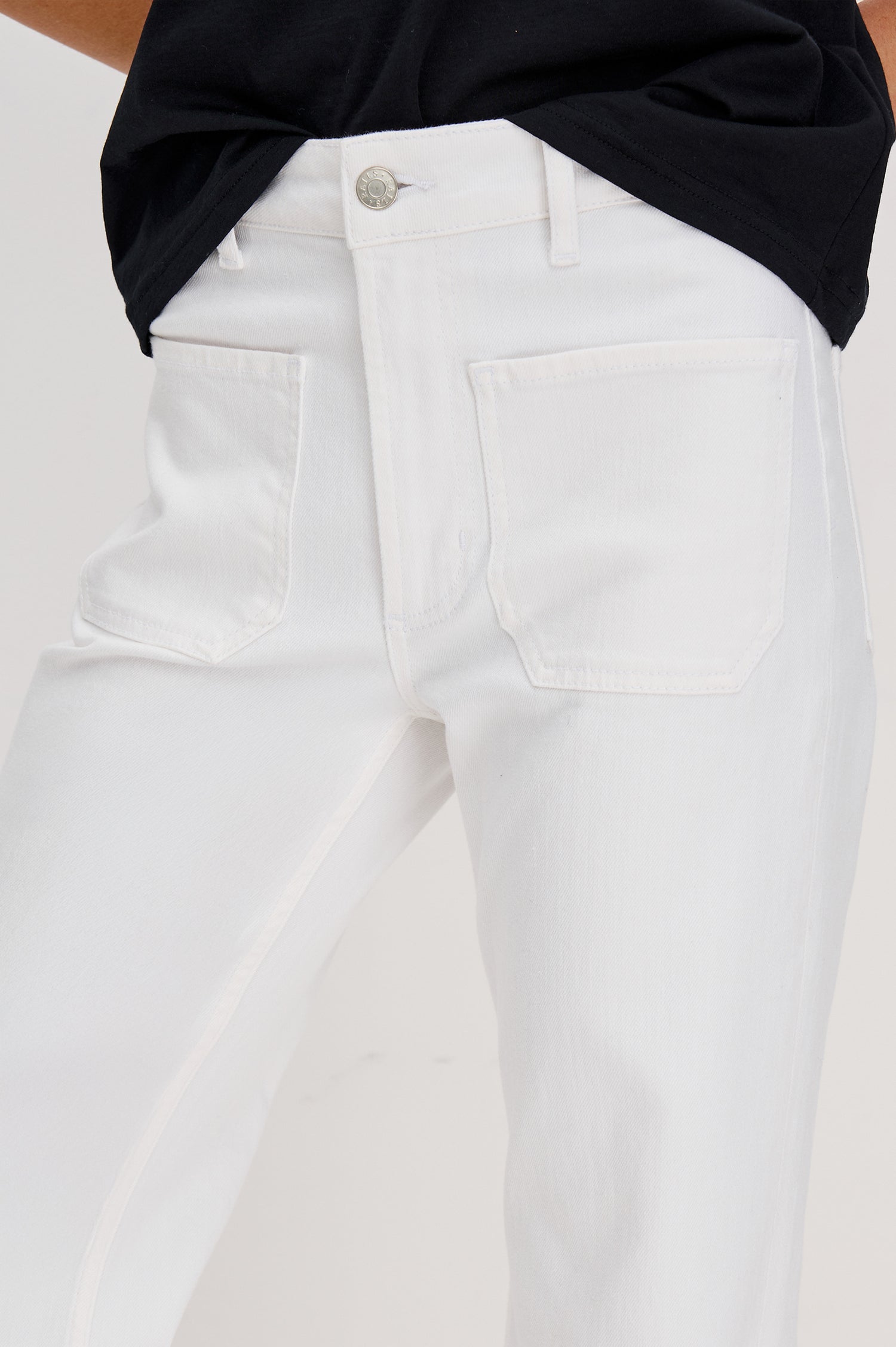 Alamitos Flared Denim Pant with Front Patch Pockets, Belt Loops and Zipper Button Fly in Salt White Colorway. Front Detail View Shown on Model.