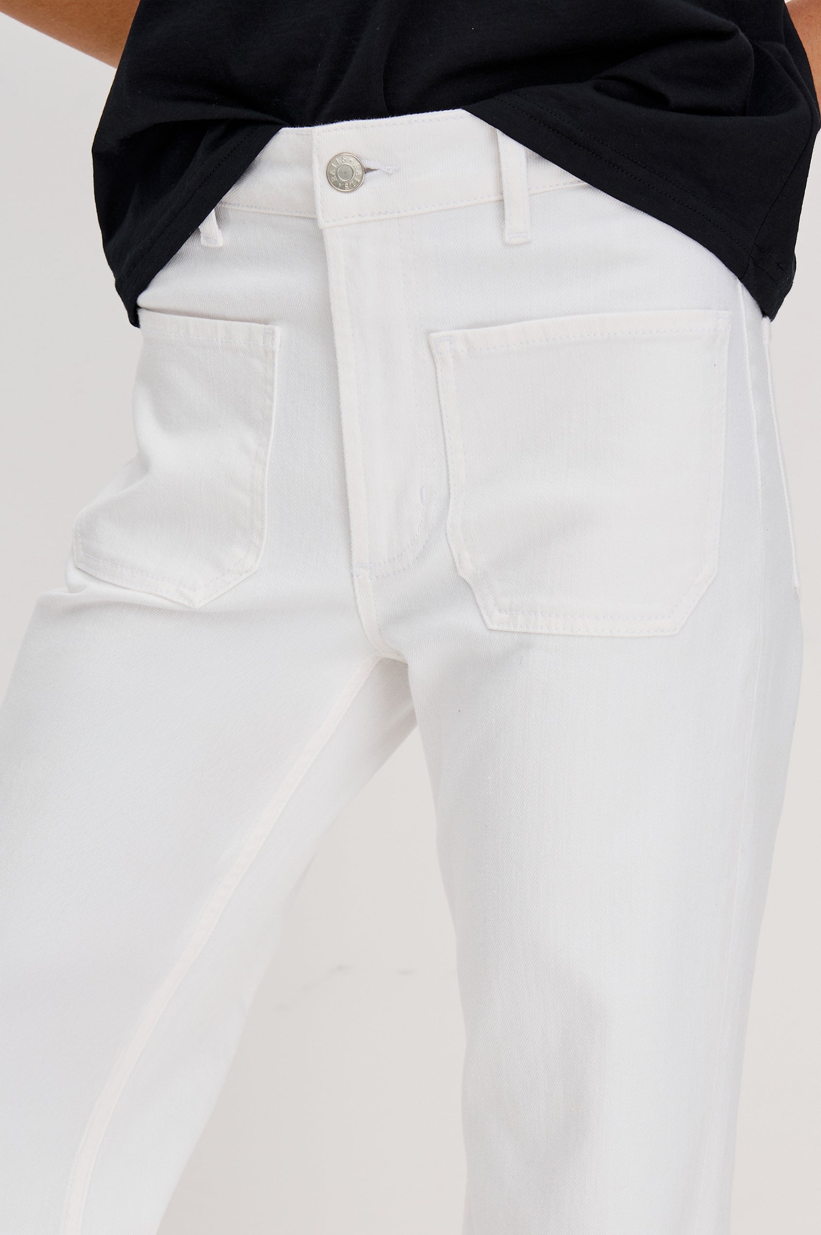 Alamitos Flared Denim Pant with Front Patch Pockets, Belt Loops and Zipper Button Fly in Salt White Colorway. Front Detail View Shown on Model.