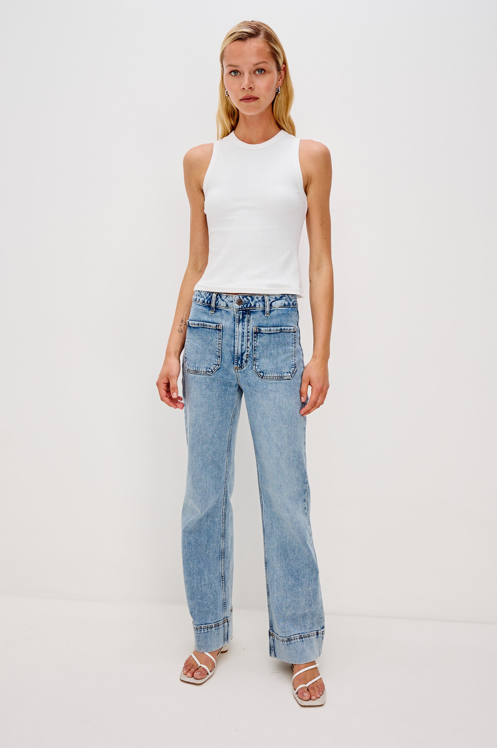 Alamitos high waisted denim trouser with flared leg and front patch pockets in Serenity - full body front view on model