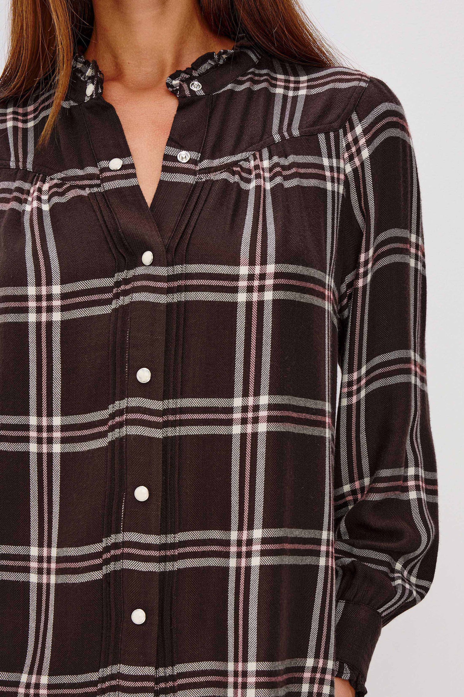 Alanna Long Sleeve Shirt with Snaps Down the Front, a Ruffled Collar, Banded Ruffed Cuffs, and Pleats at the Yoke Seam in Chocolate Napoleon Colorway - Close Up of Details featured on model.