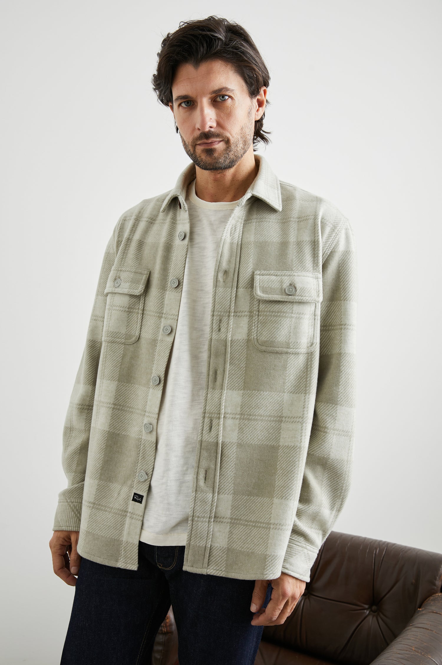 Alder Long-Sleeve Button up with Two Buttoned Chest Flap Pockets in Fawn Cream Colorway, a plaid - Front Unbuttoned View Featured on Model