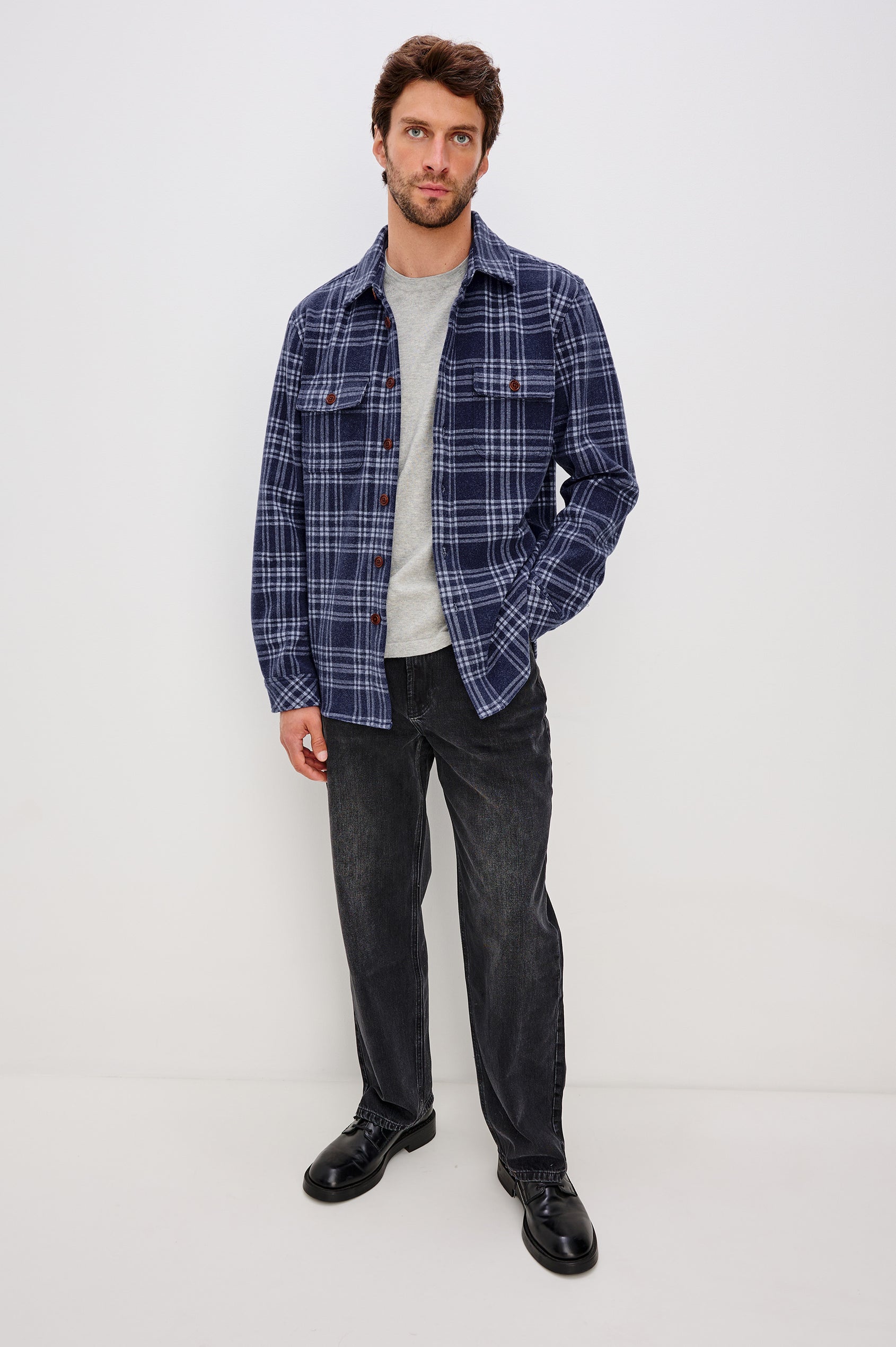 Alder Long-Sleeve Button up with Two Buttoned Chest Flap Pockets in Frost Harbor Colorway, a Blue and White plaid. Front Full Body View Featured on Model