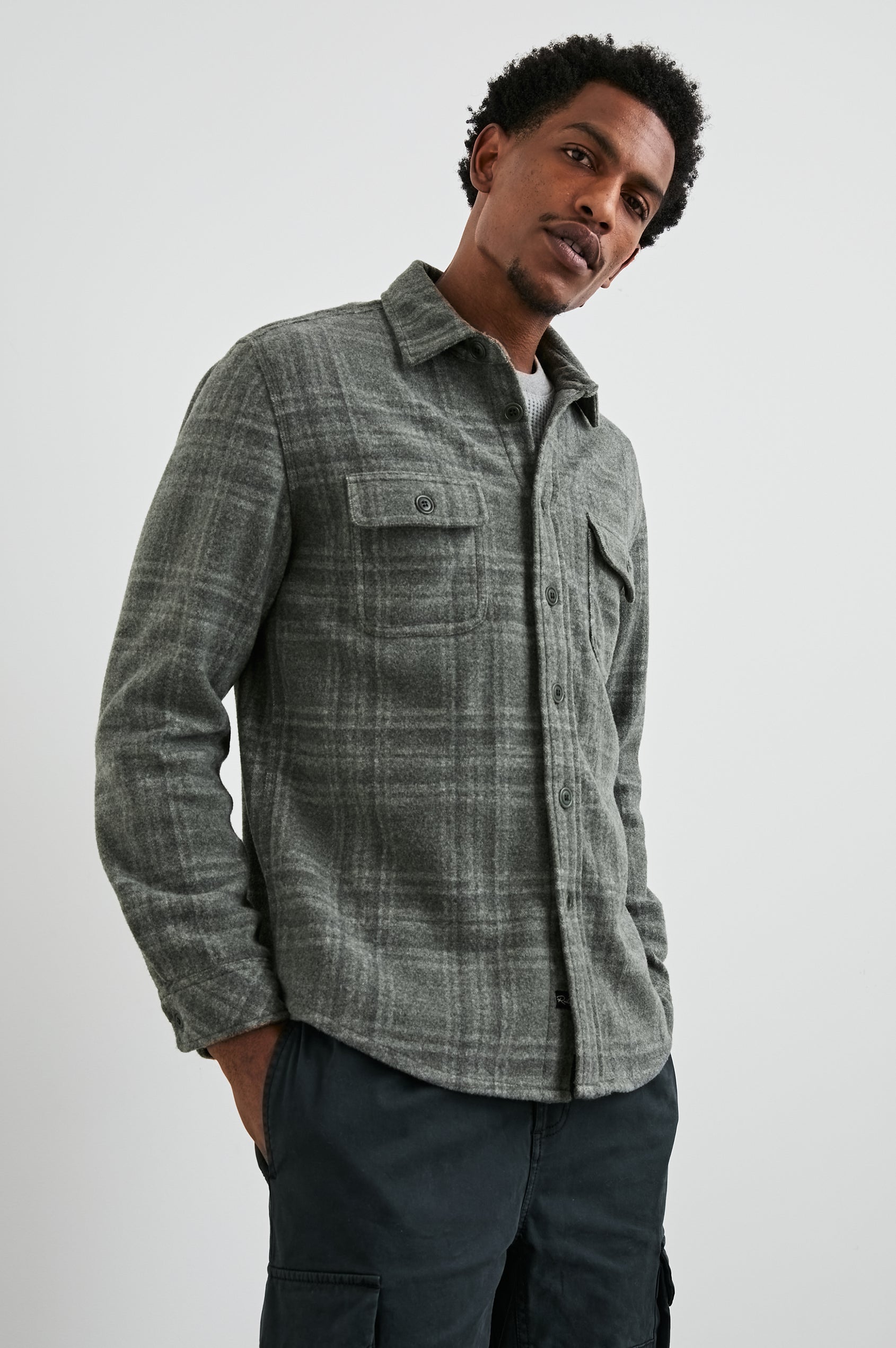 Alder Long-Sleeve Button up with Two Buttoned Chest Flap Pockets in Mossy Glen Colorway, a plaid - Front View Featured on Model