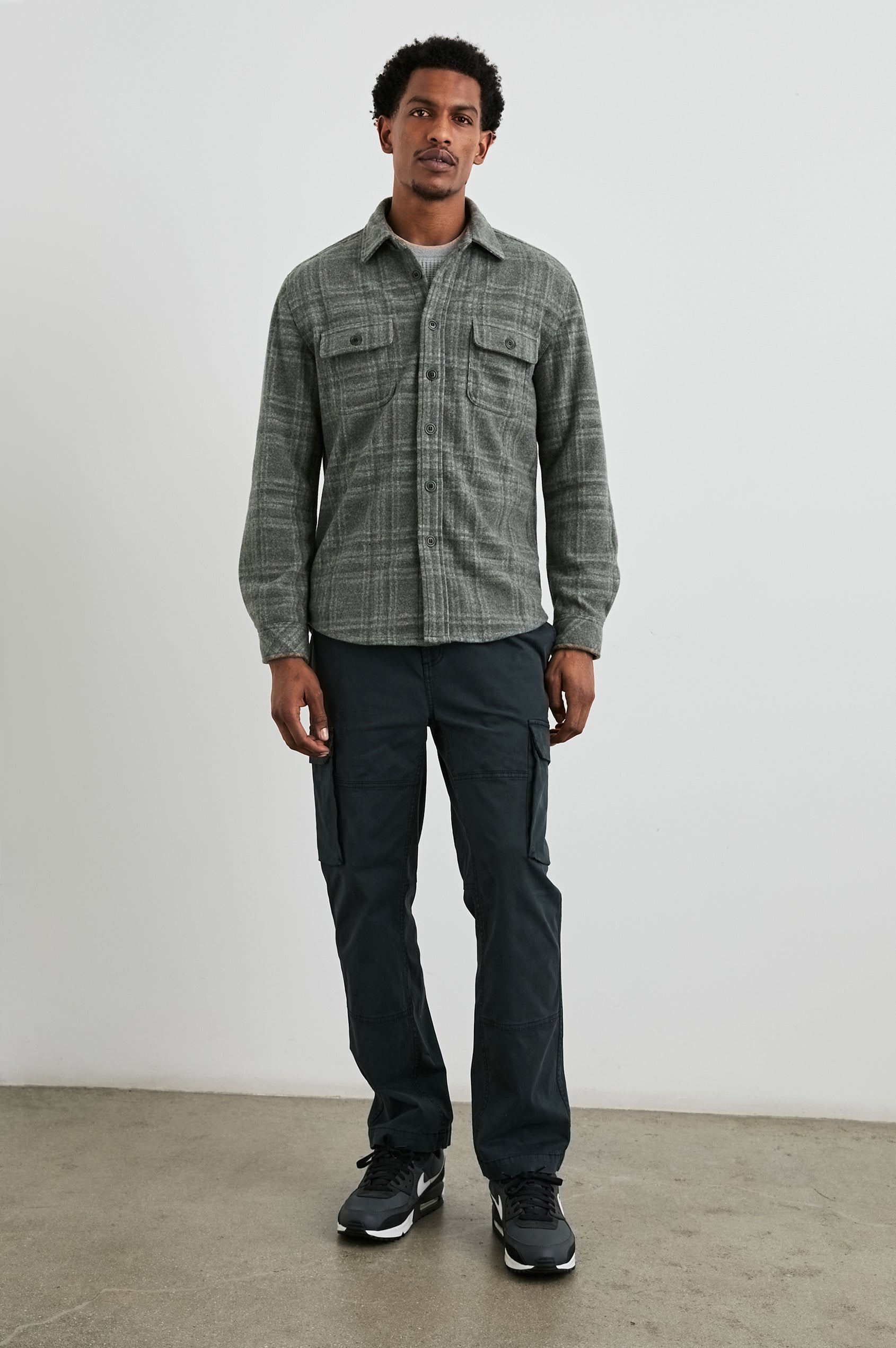 Alder Long-Sleeve Button up with Two Buttoned Chest Flap Pockets in Mossy Glen Colorway, a plaid - Front Full Body View Featured on Model