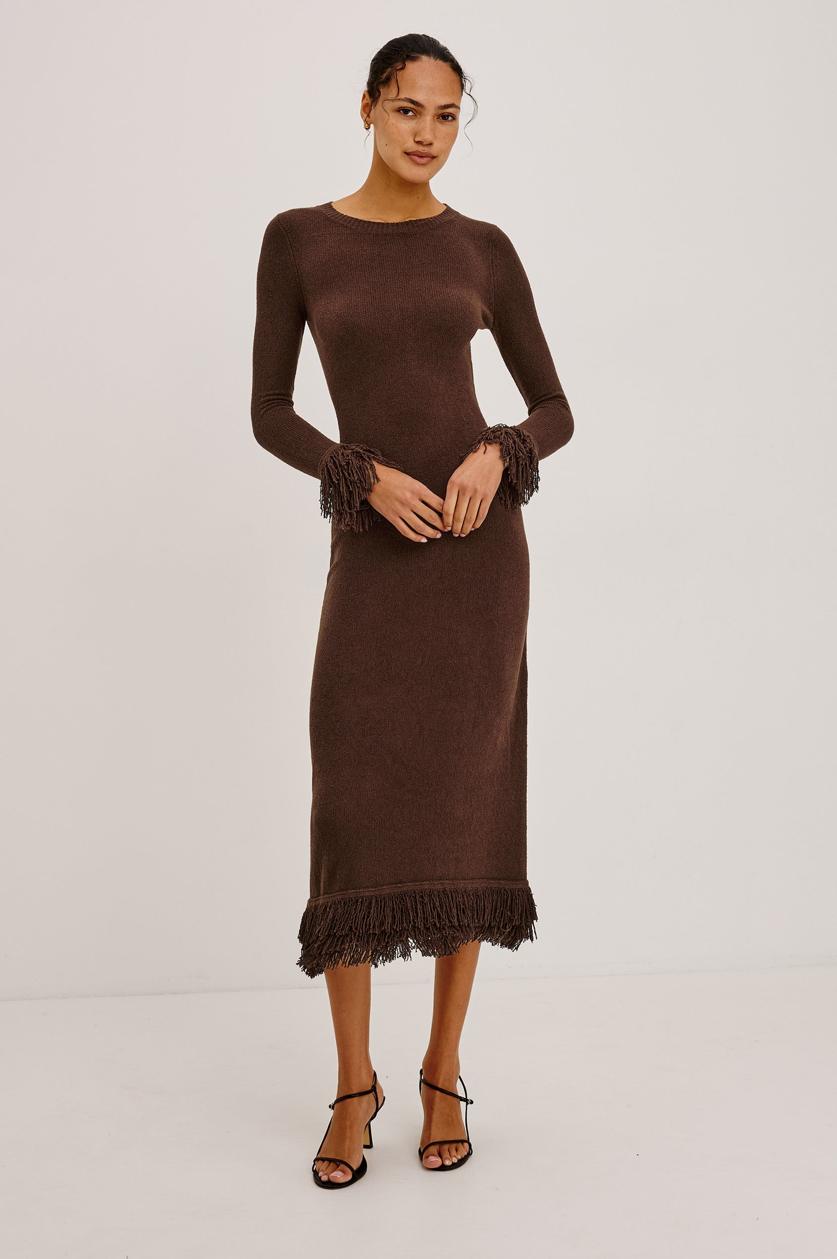 Alejandra Midi Dress in Silk Blend Knit With Fitted Body, Crew Neck, Long Sleeves, and Fringe Trim at the Cuffs and Straight Hem in Espresso Colorway - Full Body Front View Featured on Model