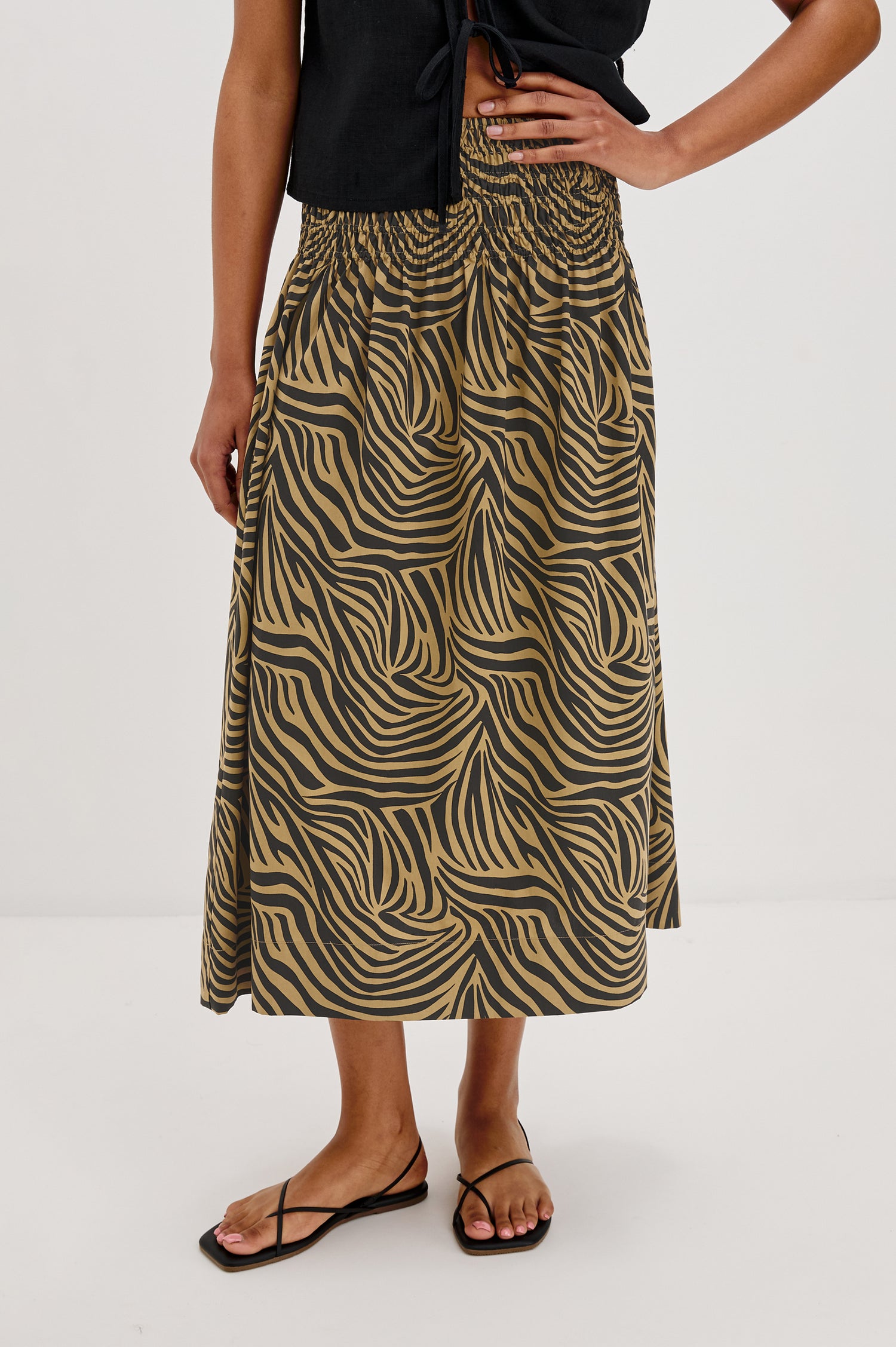 Alessa Midi Skirt with a Wide Elastic Gathered Waistband in Gold and Brown Cayman Colorway. Front View Shown on Model.