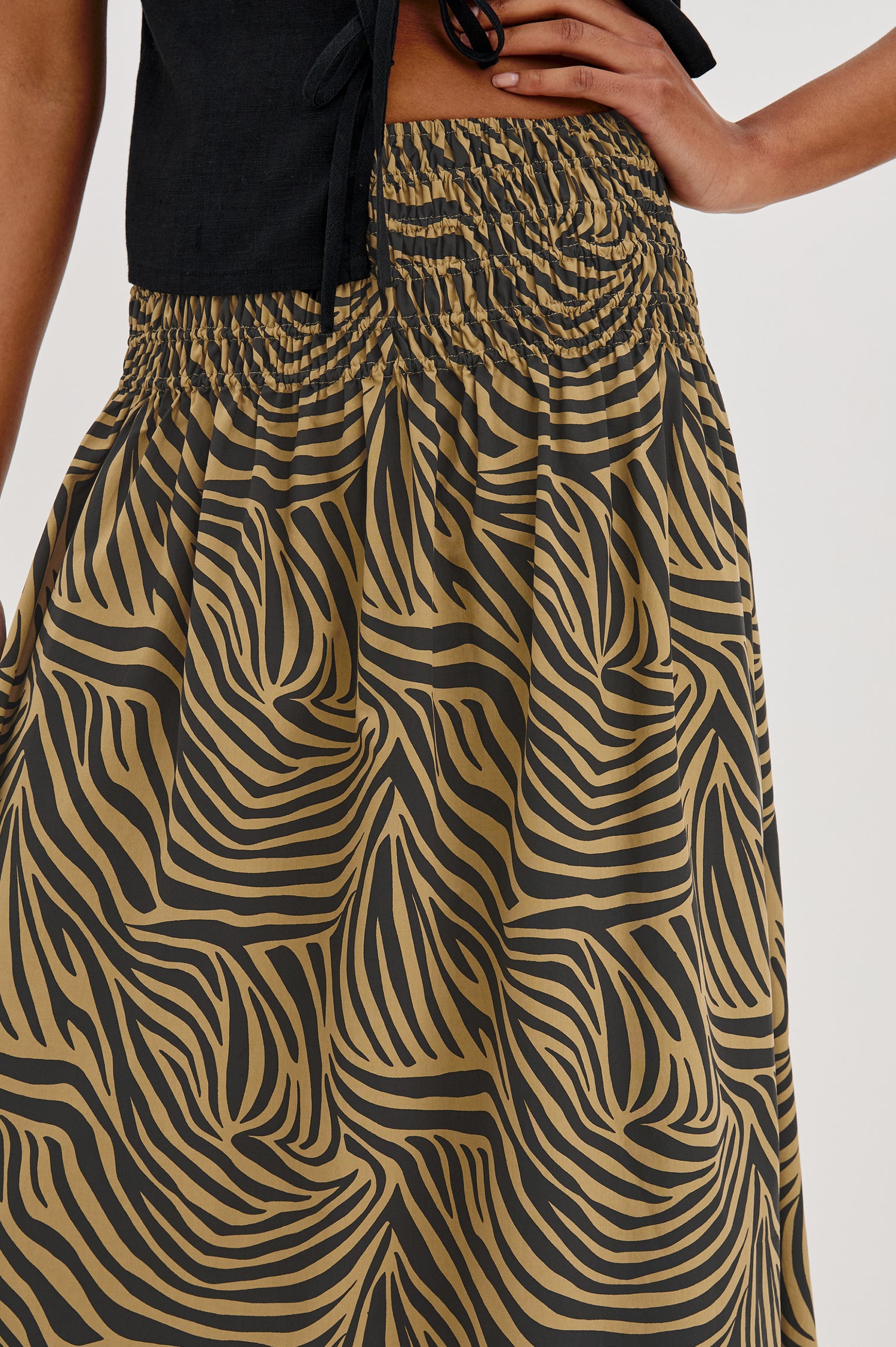 Alessa Midi Skirt with a Wide Elastic Gathered Waistband in Gold and Brown Cayman Colorway. Front Detailed View Shown on Model.