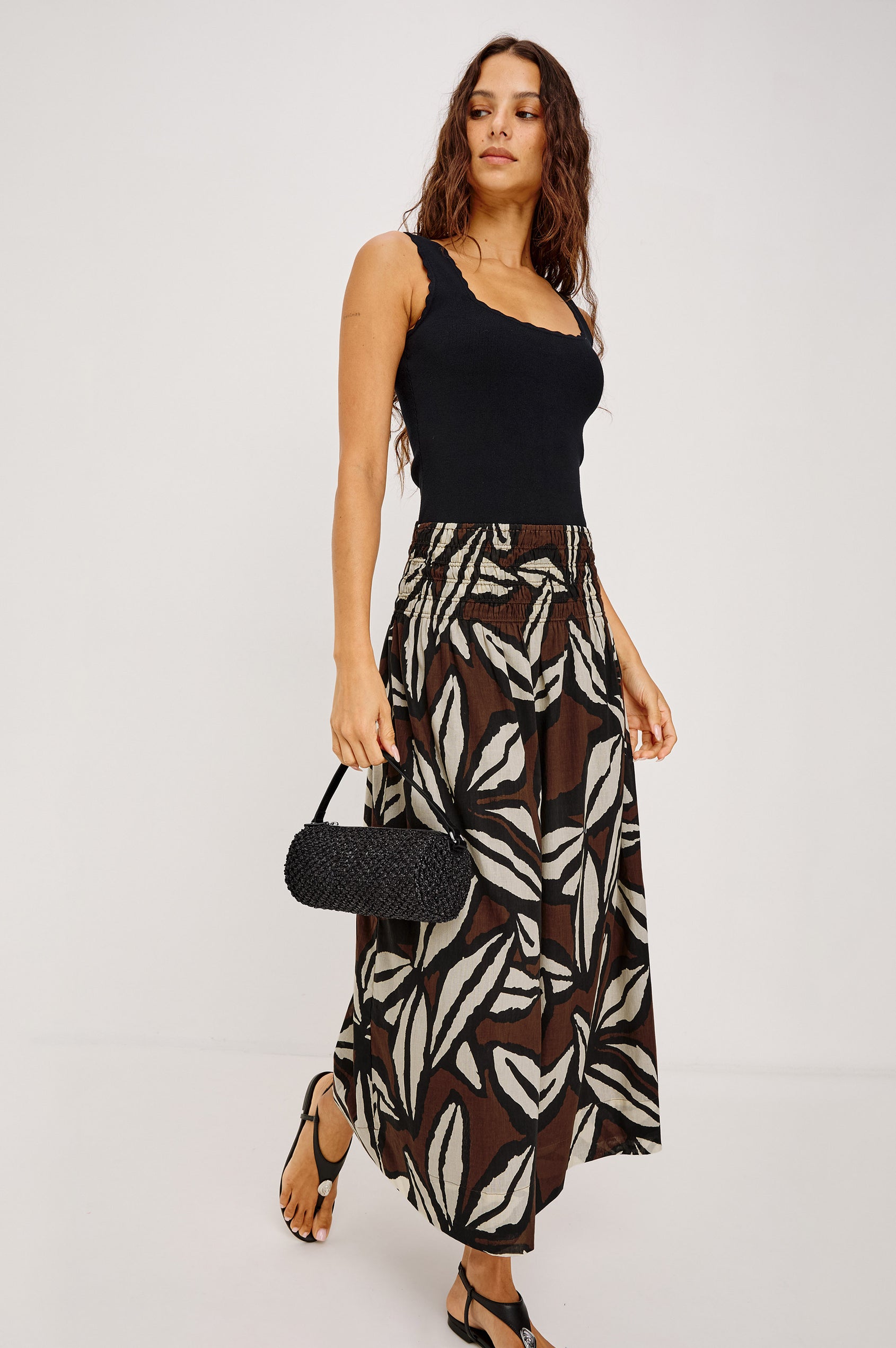 Alessa Midi Skirt in Heavy Linen With Wide Smocked Waistband and A-Line Silhouette in White Colorway - Lower Body Back View Featured on Model