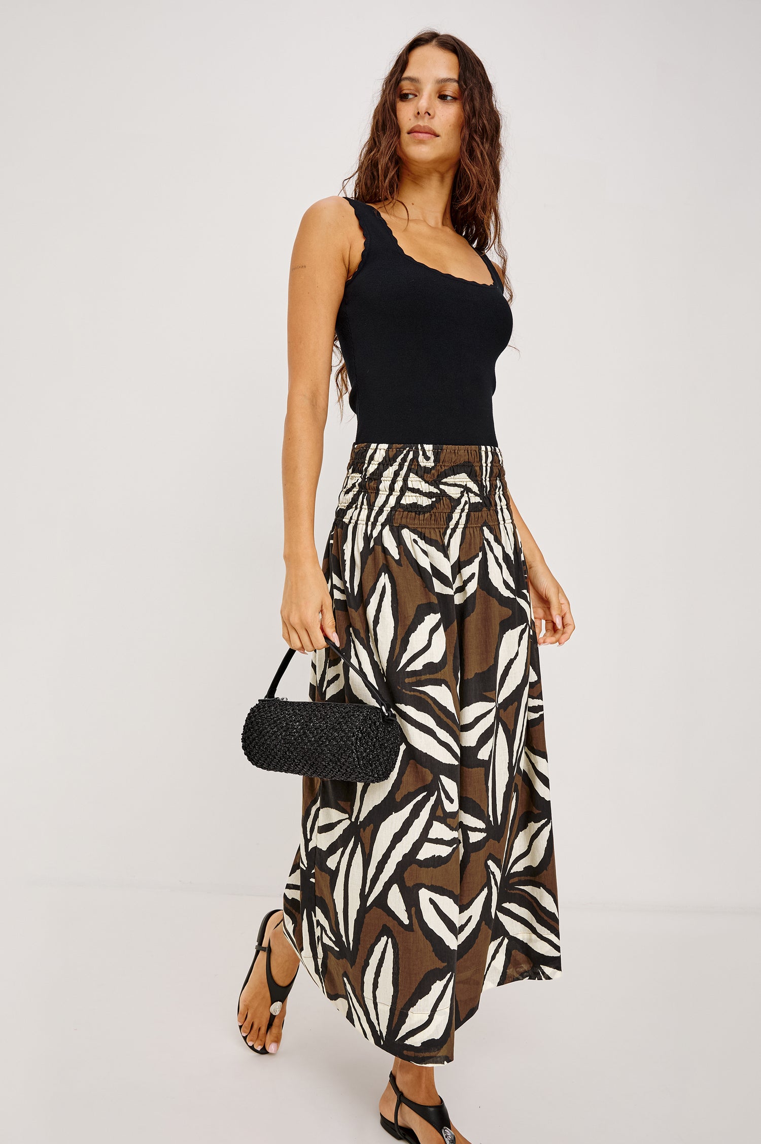 Alessa Midi Skirt in Heavy Linen With Wide Smocked Waistband and A-Line Silhouette in White Colorway - Lower Body Back View Featured on Model
