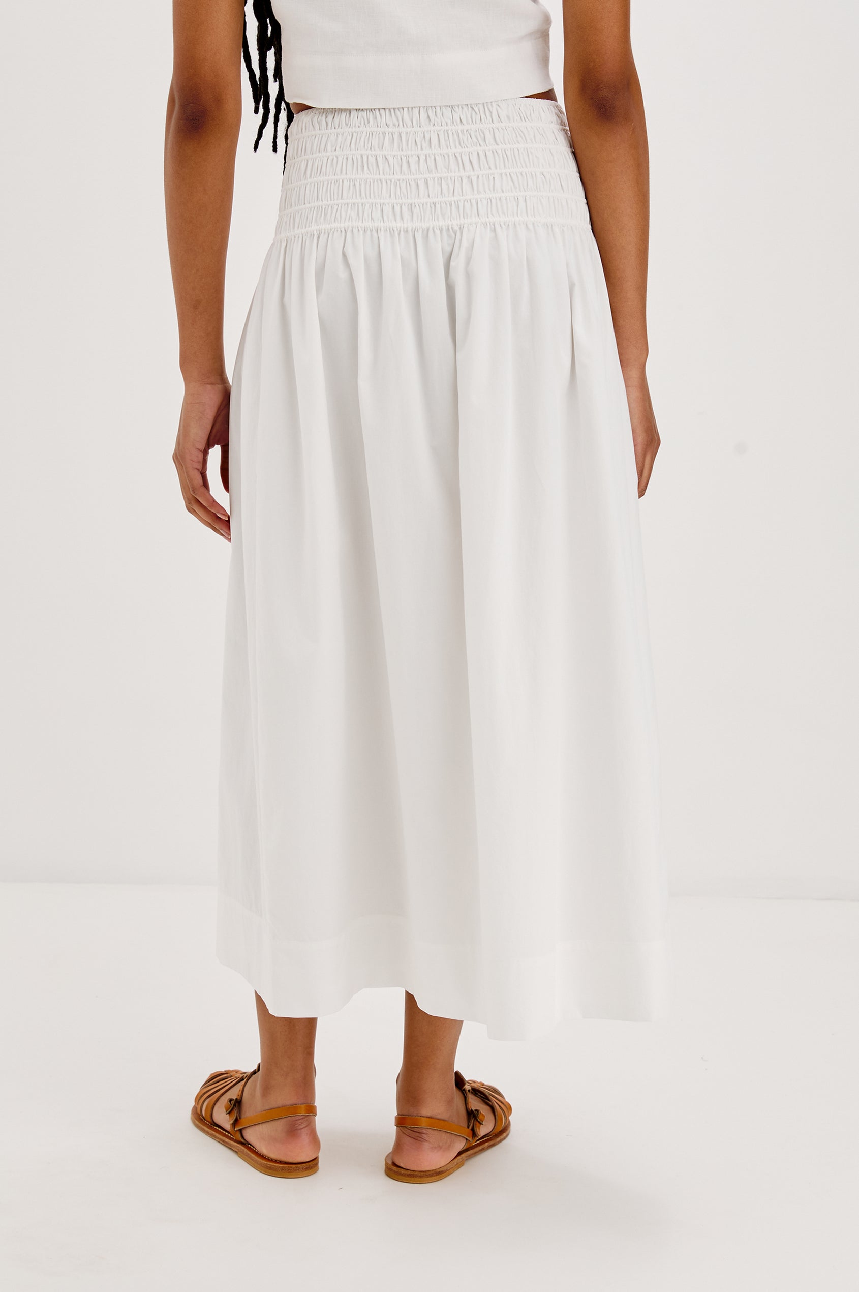 Alessa Midi Skirt with a Wide Elastic Gathered Waistband in White Colorway. Back View Shown on Model.