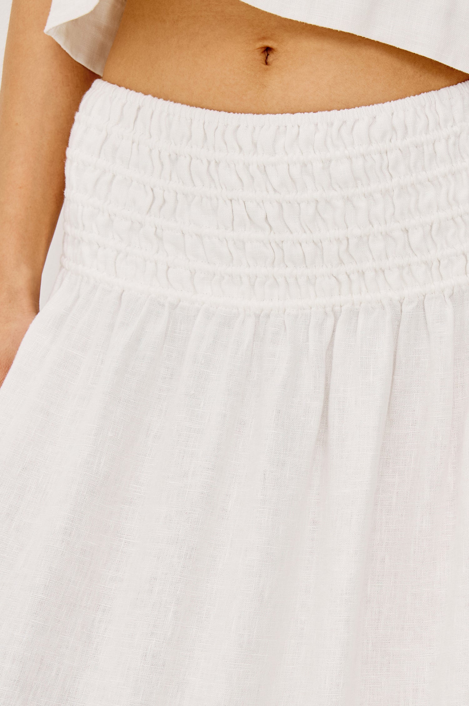 Alessa Midi Skirt in Heavy Linen With Wide Smocked Waistband and A-Line Silhouette in White Colorway - Close Up Detail View Featured on Model