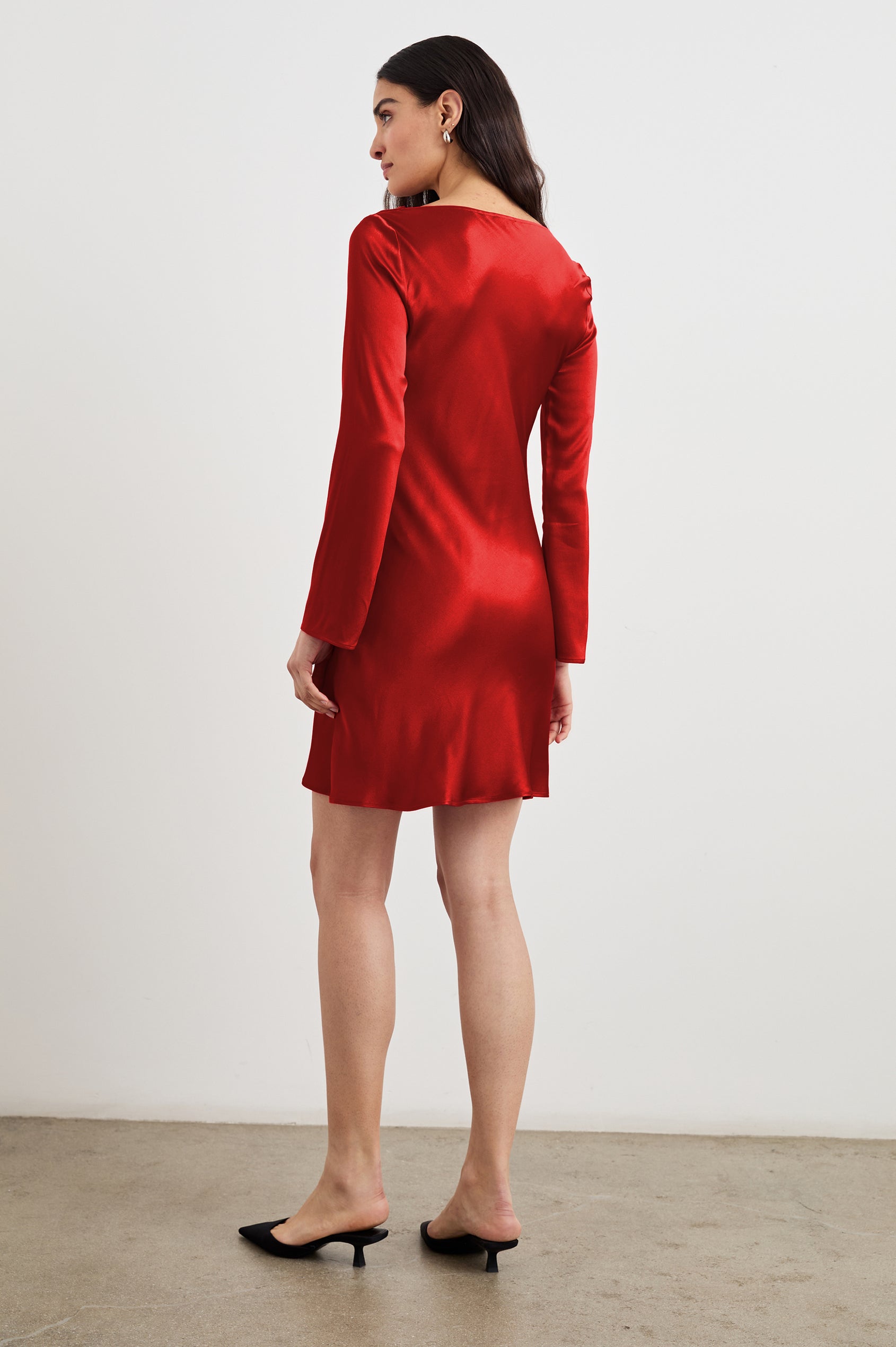 Alessandra Long Sleeve Mini Dress with a Slight Cowl at the Neck and Ruching with a Drawstring on the Left Side in Scarlet Colorway - Back Full Body View Featured on Model