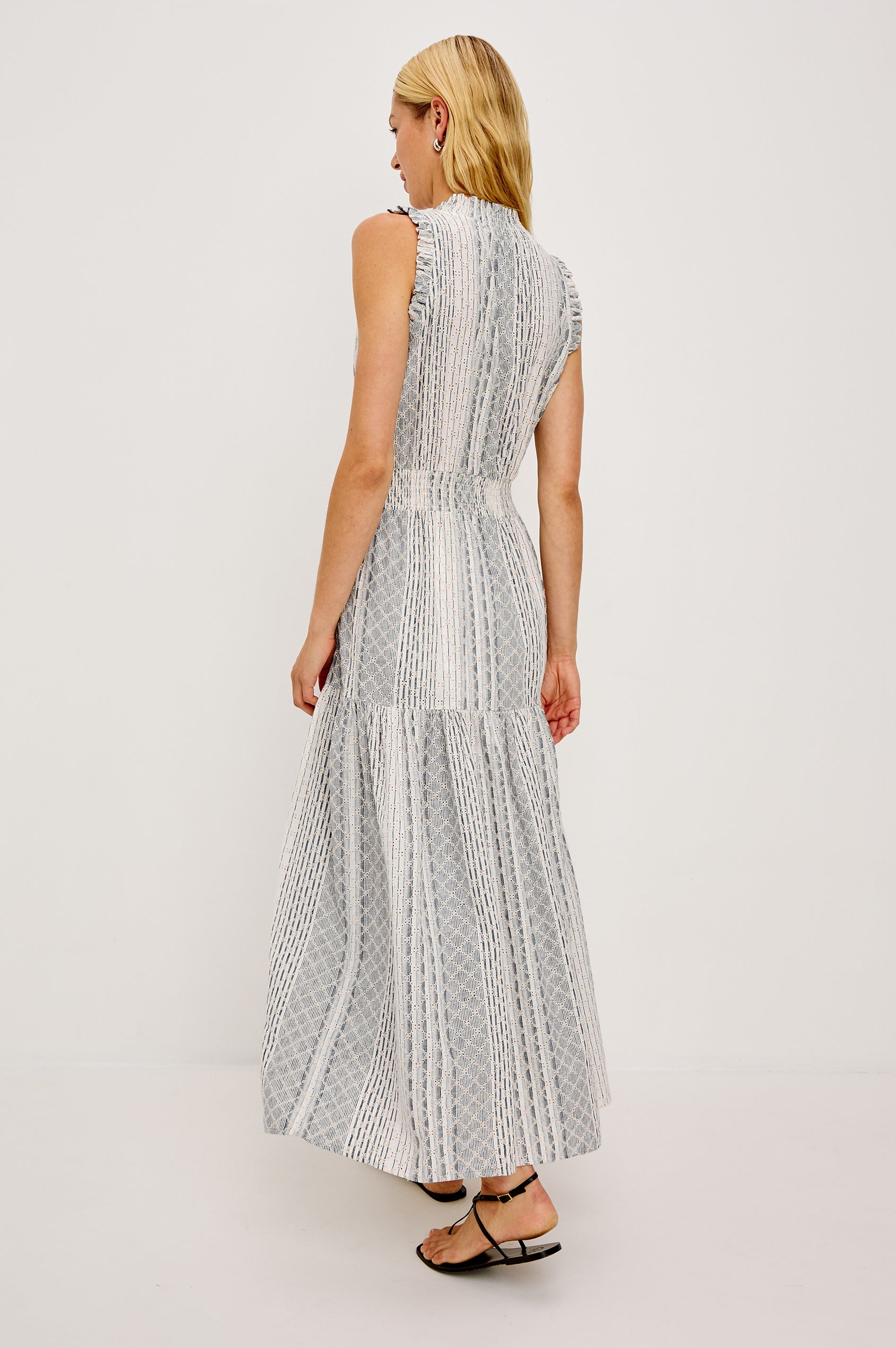 Alessi Maxi Dress in Linen With Smocked Split V-Neckline With Center-Front Ties Diamond Eyelet Detailing All Over Ruffled Trim and Fully Lined Tiered Skirt in Striped Eyelet Colorway - Full Body Front View Featured on Model