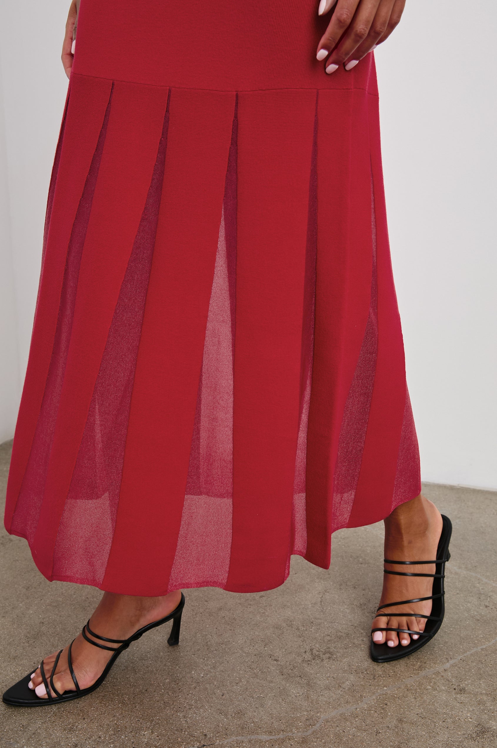 Alessia Sleeveless Maxi Dress with a Crew Neck and Sheer Vertical Inserts along the Hem from the Mid-Thigh in Scarlet Colorway - Side View Featured on Model 