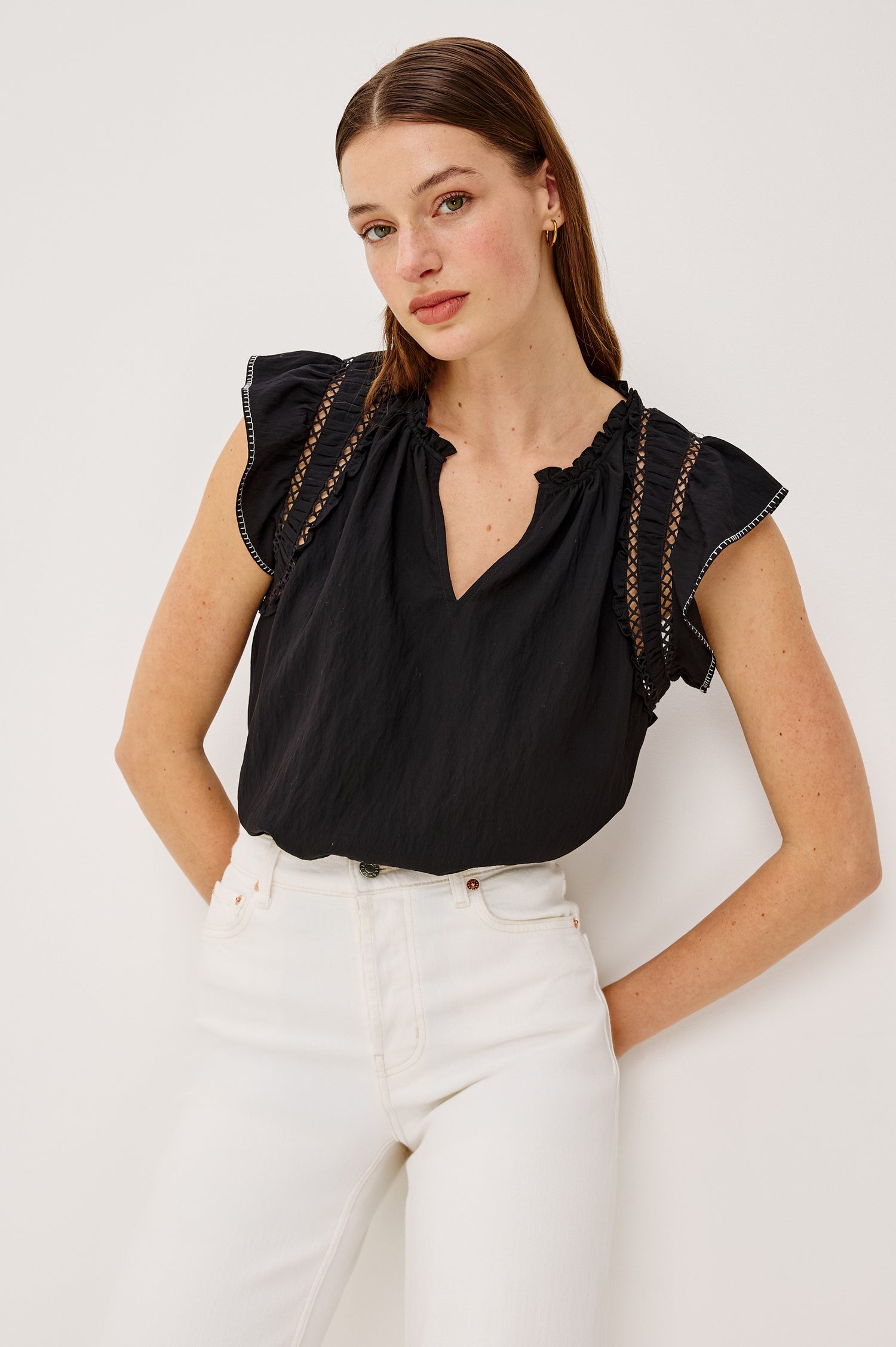 Allea Top in Poplin With Relaxed Fit Split V-Neck. Flutter Sleeves With Contrast Stitcing and Lattice Cutwork in Black Colorway - Upper Body Front View Featured on Model