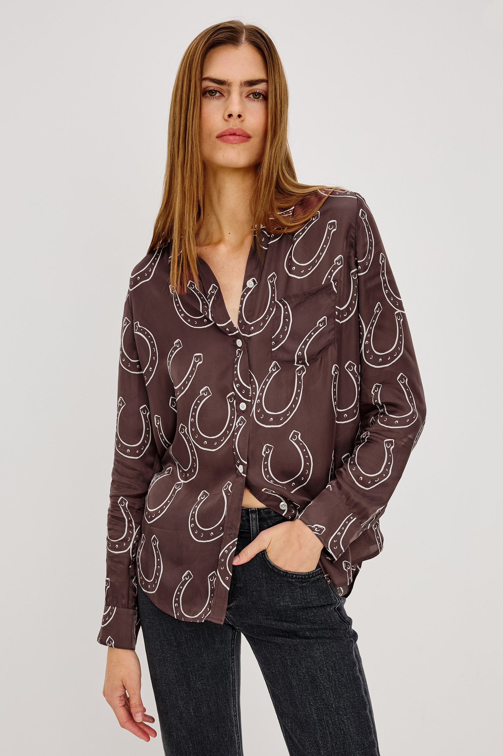 Alyssa Shirt in Luxe Lightweight Cupro With Loose Fit, Collar, Front Buttons, Long Sleeves, and Curved Back Hem in Brown Horsehoes Colorway - Upper Body Front View Featured on Model