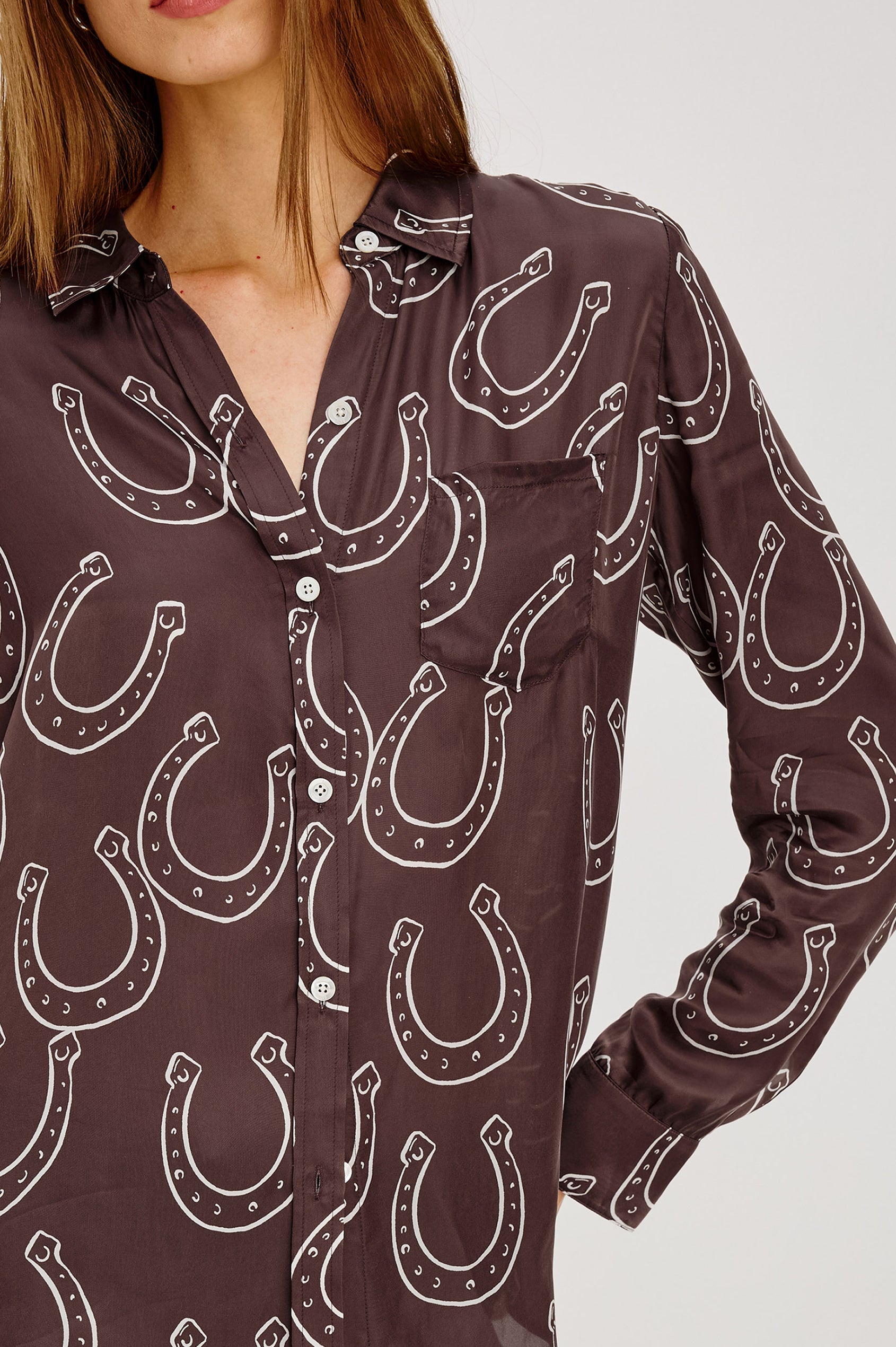 Alyssa Shirt in Luxe Lightweight Cupro With Loose Fit, Collar, Front Buttons, Long Sleeves, and Curved Back Hem in Brown Horsehoes Colorway - Upper Body Front View Featured on Model