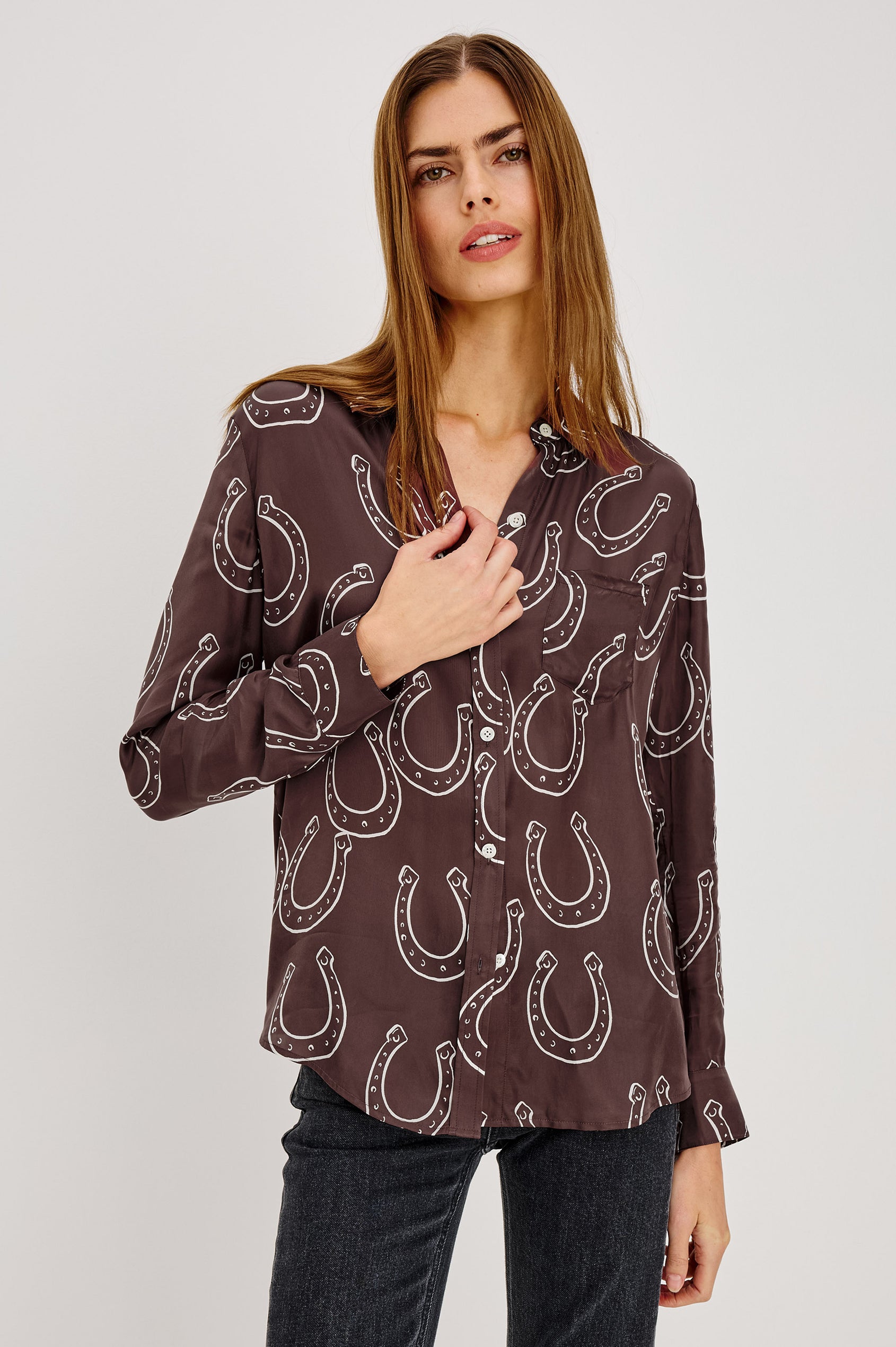 Alyssa Shirt in Luxe Lightweight Cupro With Loose Fit, Collar, Front Buttons, Long Sleeves, and Curved Back Hem in Brown Horsehoes Colorway - Upper Body Front View Featured on Model