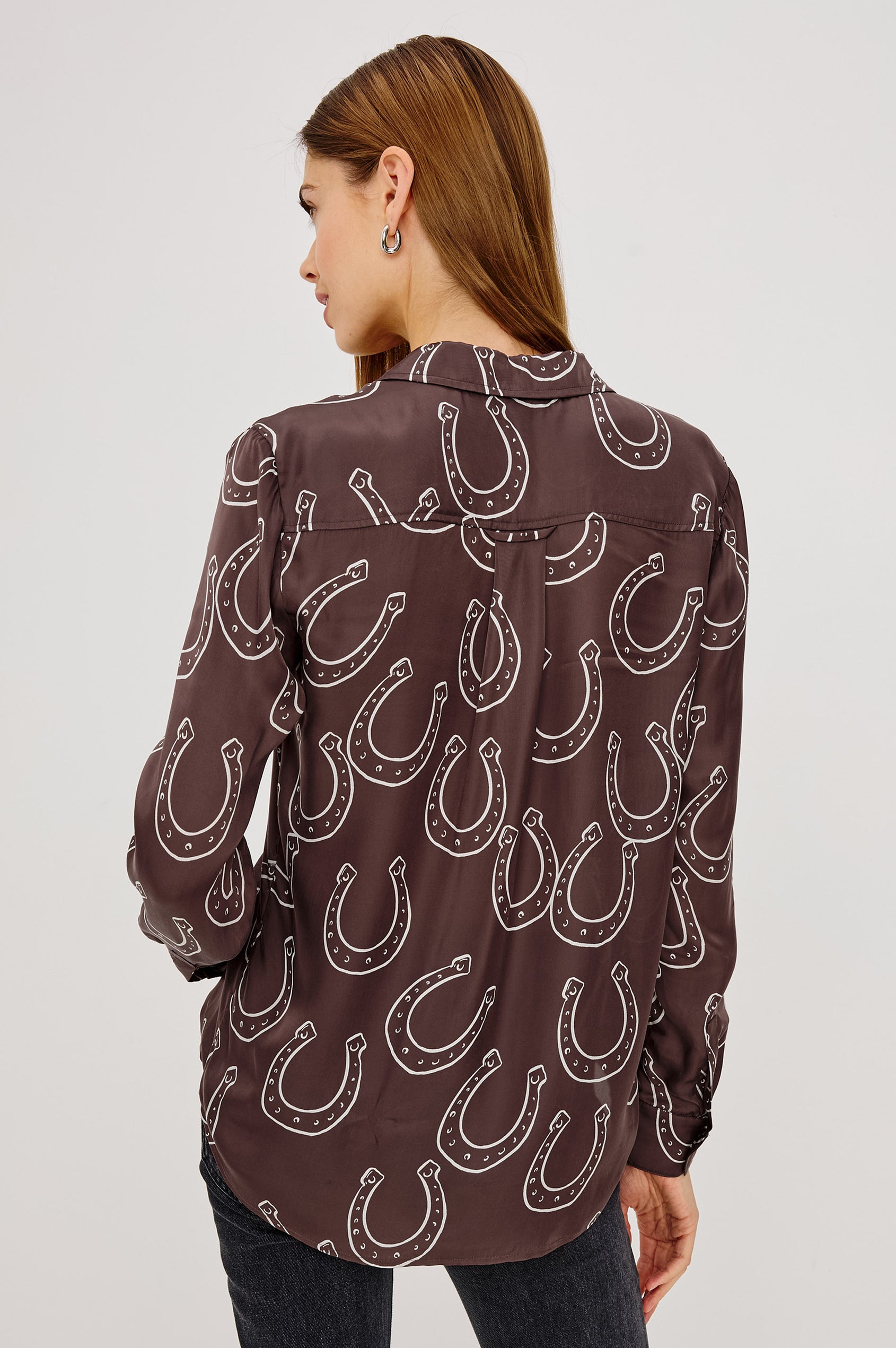 Alyssa Shirt in Luxe Lightweight Cupro With Loose Fit, Collar, Front Buttons, Long Sleeves, and Curved Back Hem in Brown Horsehoes Colorway - Upper Body Back View Featured on Model