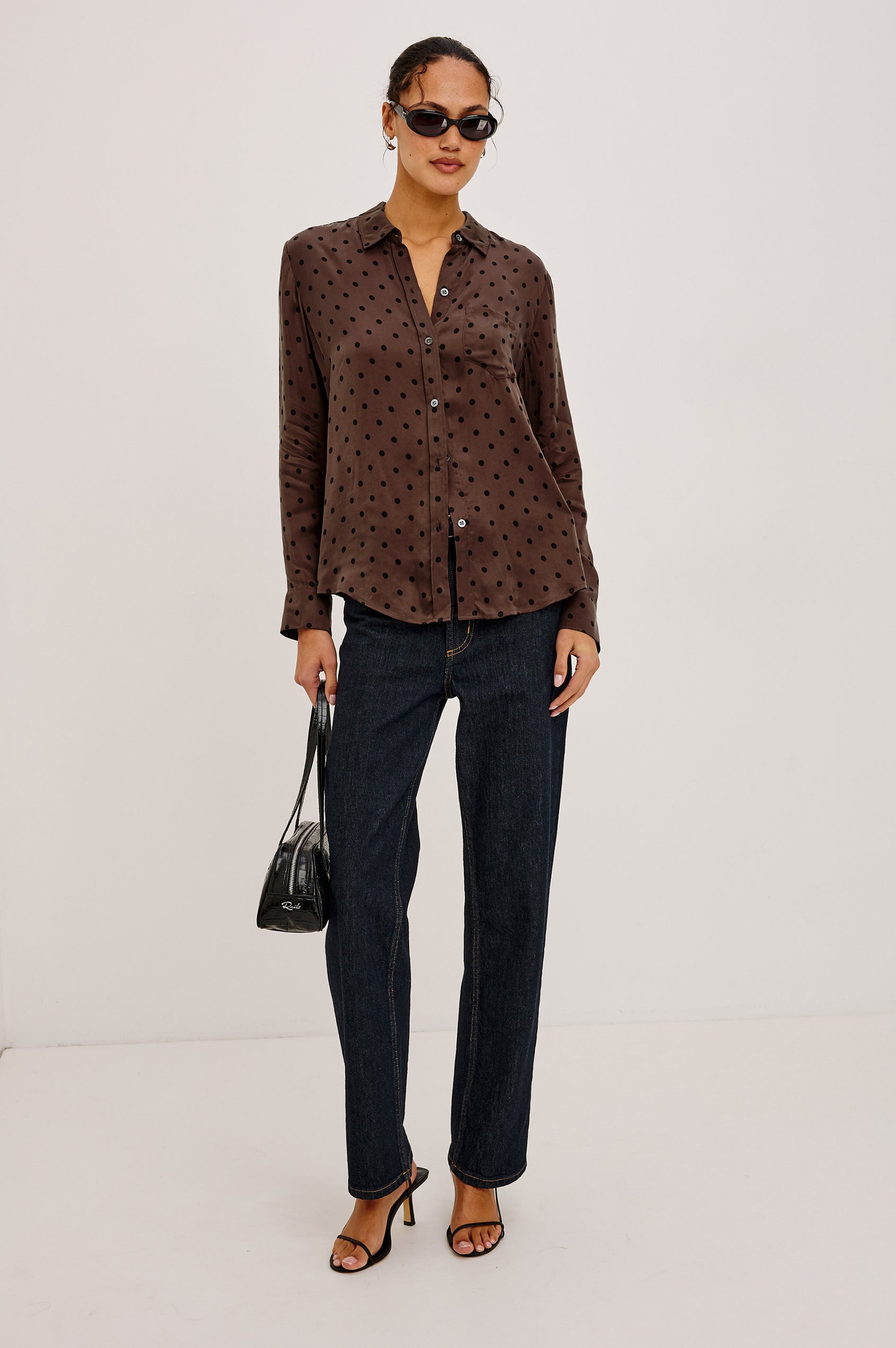Alyssa Shirt in Luxe Lightweight Cupro With Loose Fit, Collar, Front Buttons, Long Sleeves, and Curved Back Hem in Chocolate Polka Dot Colorway - Full Body Front View Featured on Model