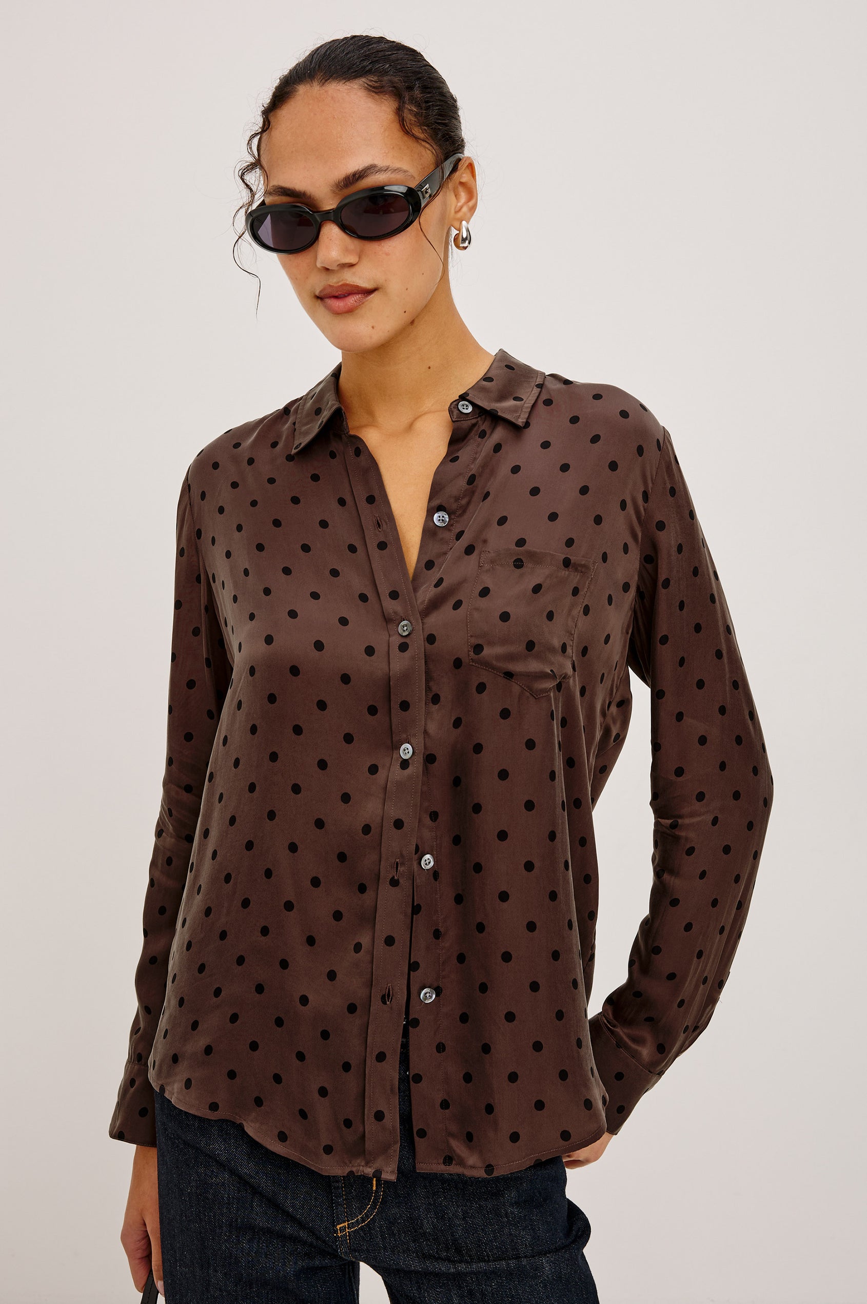 Alyssa Shirt in Luxe Lightweight Cupro With Loose Fit, Collar, Front Buttons, Long Sleeves, and Curved Back Hem in Chocolate Polka Dot Colorway - Upper Body Front View Featured on Model