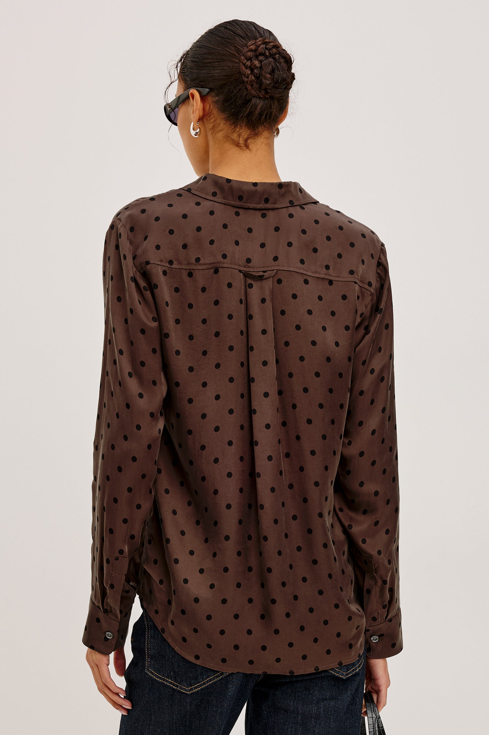 Alyssa Shirt in Luxe Lightweight Cupro With Loose Fit, Collar, Front Buttons, Long Sleeves, and Curved Back Hem in Chocolate Polka Dot Colorway - Upper Body Back View Featured on Model