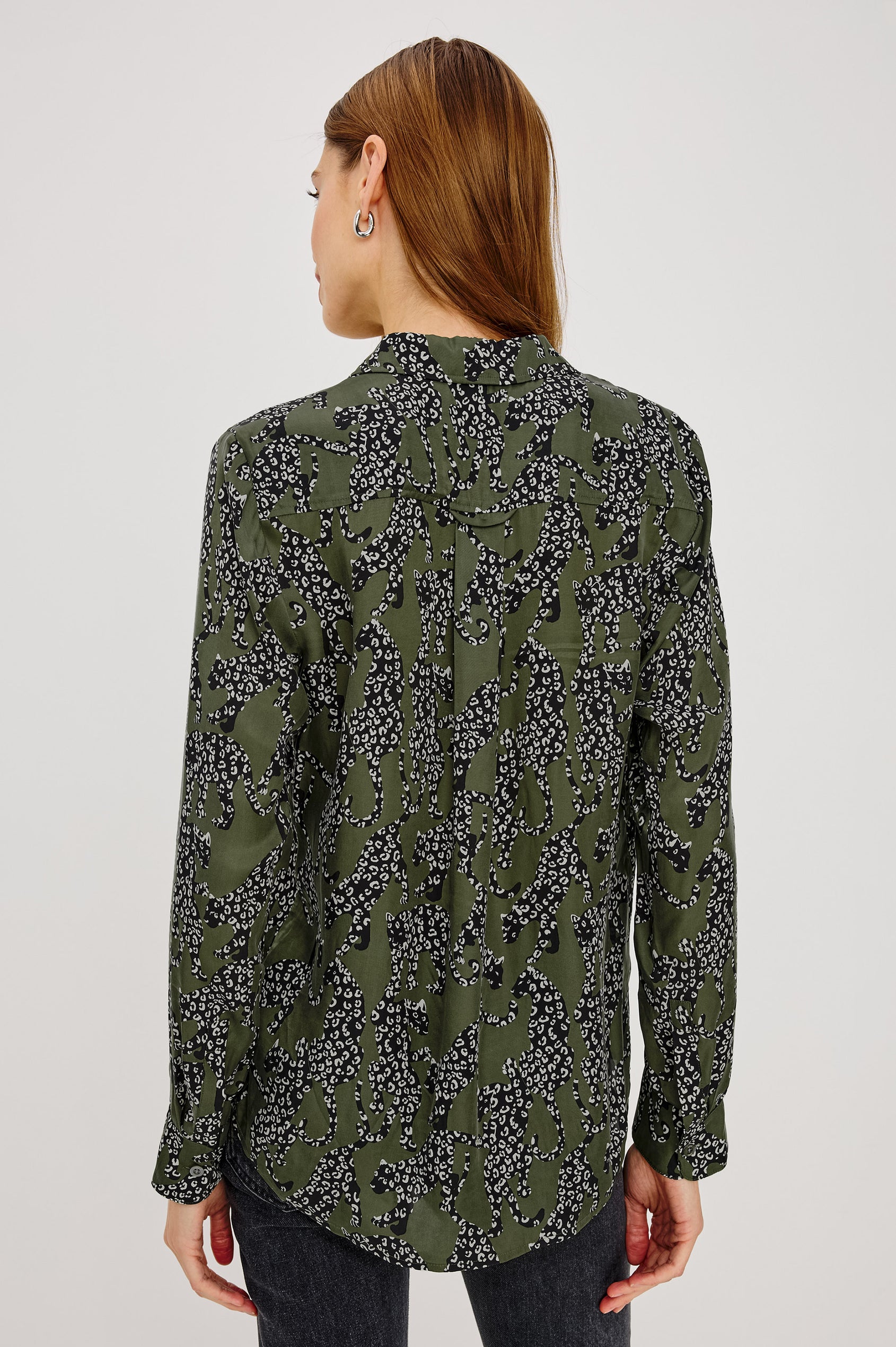 Alyssa Shirt in Luxe Lightweight Cupro With Loose Fit, Collar, Front Buttons, Long Sleeves, and Curved Back Hem in Olive Jaguar Colorway - Upper Body Back View Featured on Model