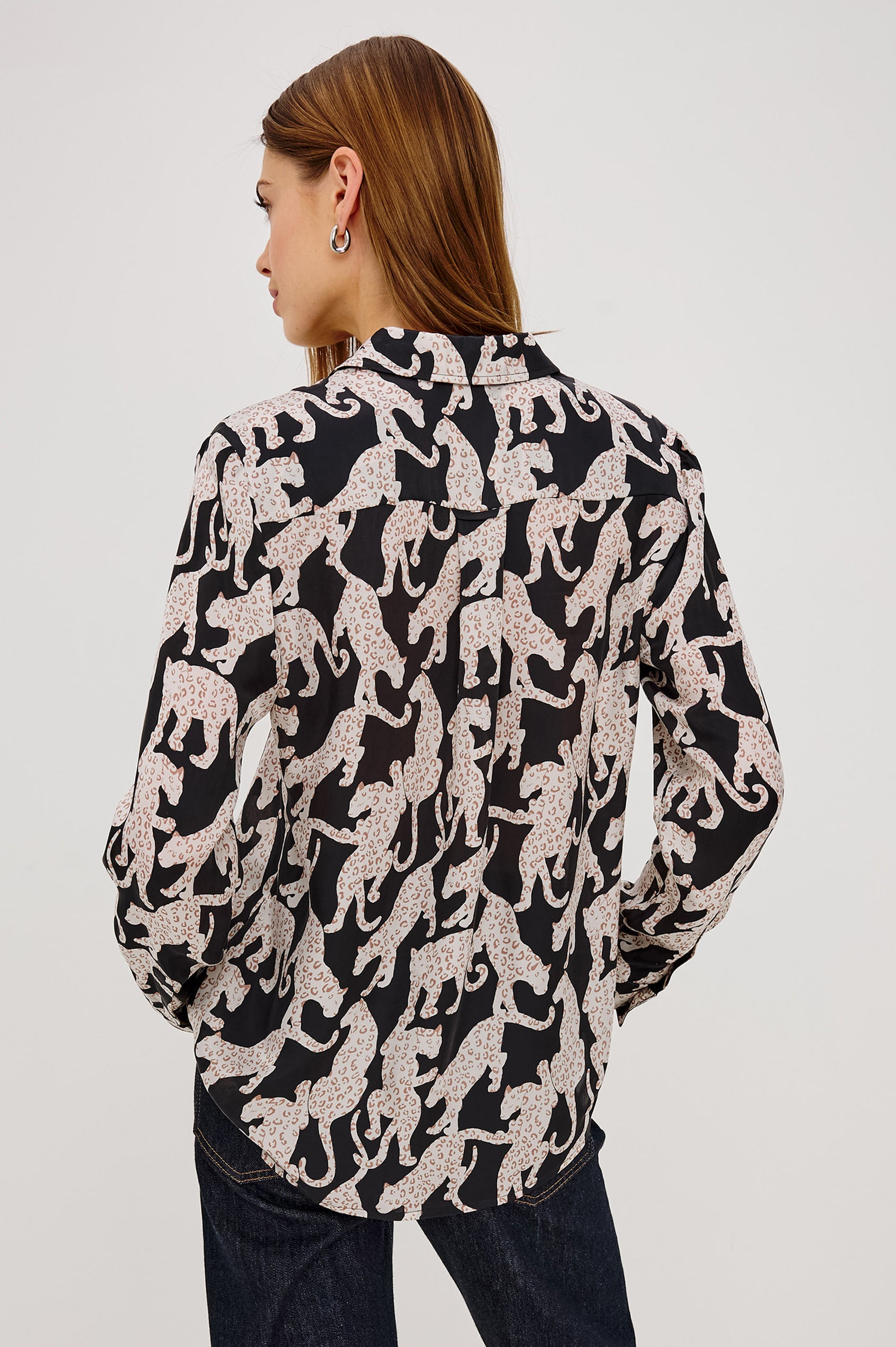 Alyssa Shirt in Luxe Lightweight Cupro With Loose Fit, Collar, Front Buttons, Long Sleeves, and Curved Back Hem in Onyx Jaguar Colorway - Upper Body Back View Featured on Model