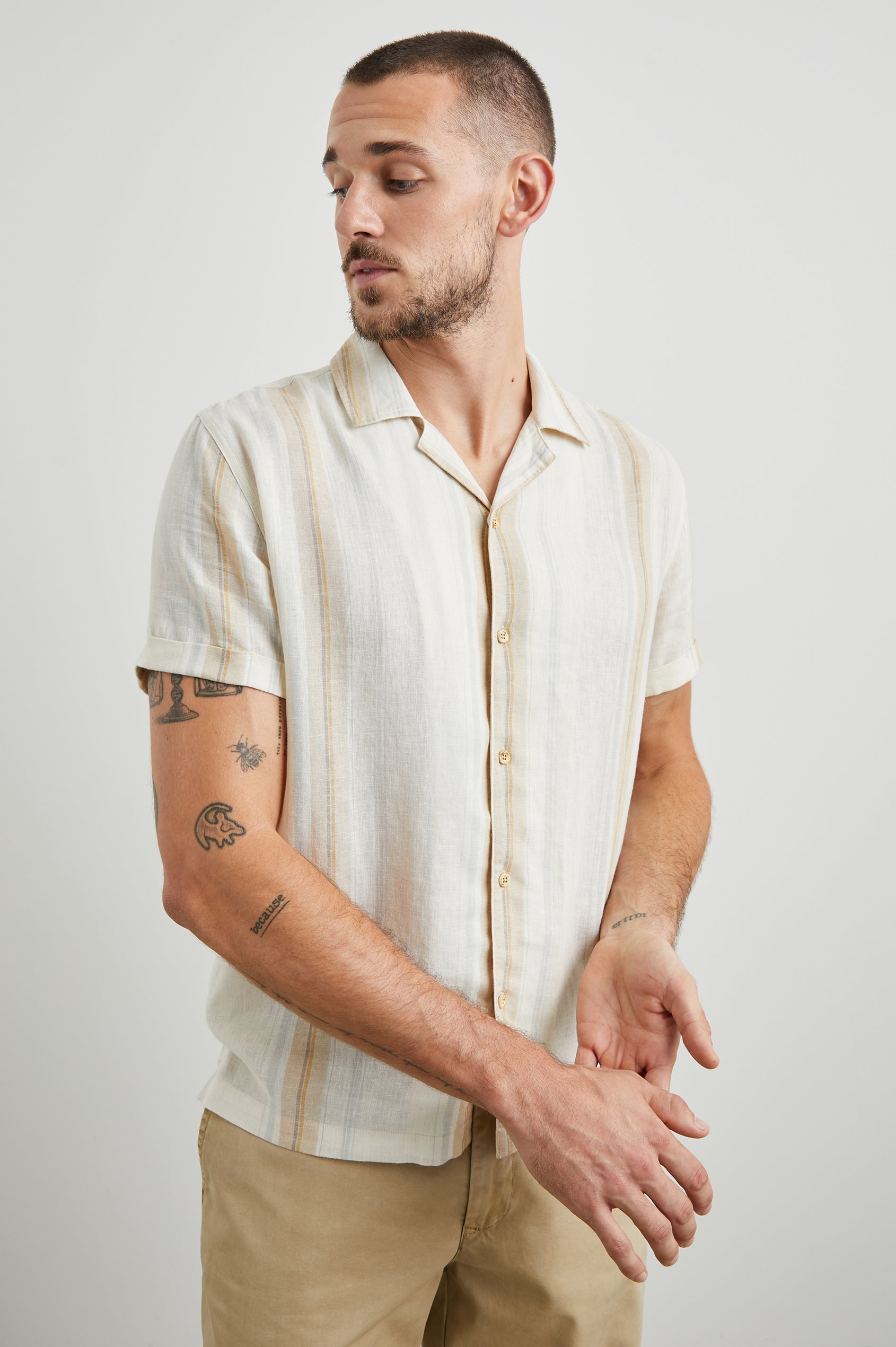 Amalfi Short-Sleeve Button Up in Farro Dove Stripe Colorway, vertical stripes in faro and pale oranges on Dove - Front View Featured on Model