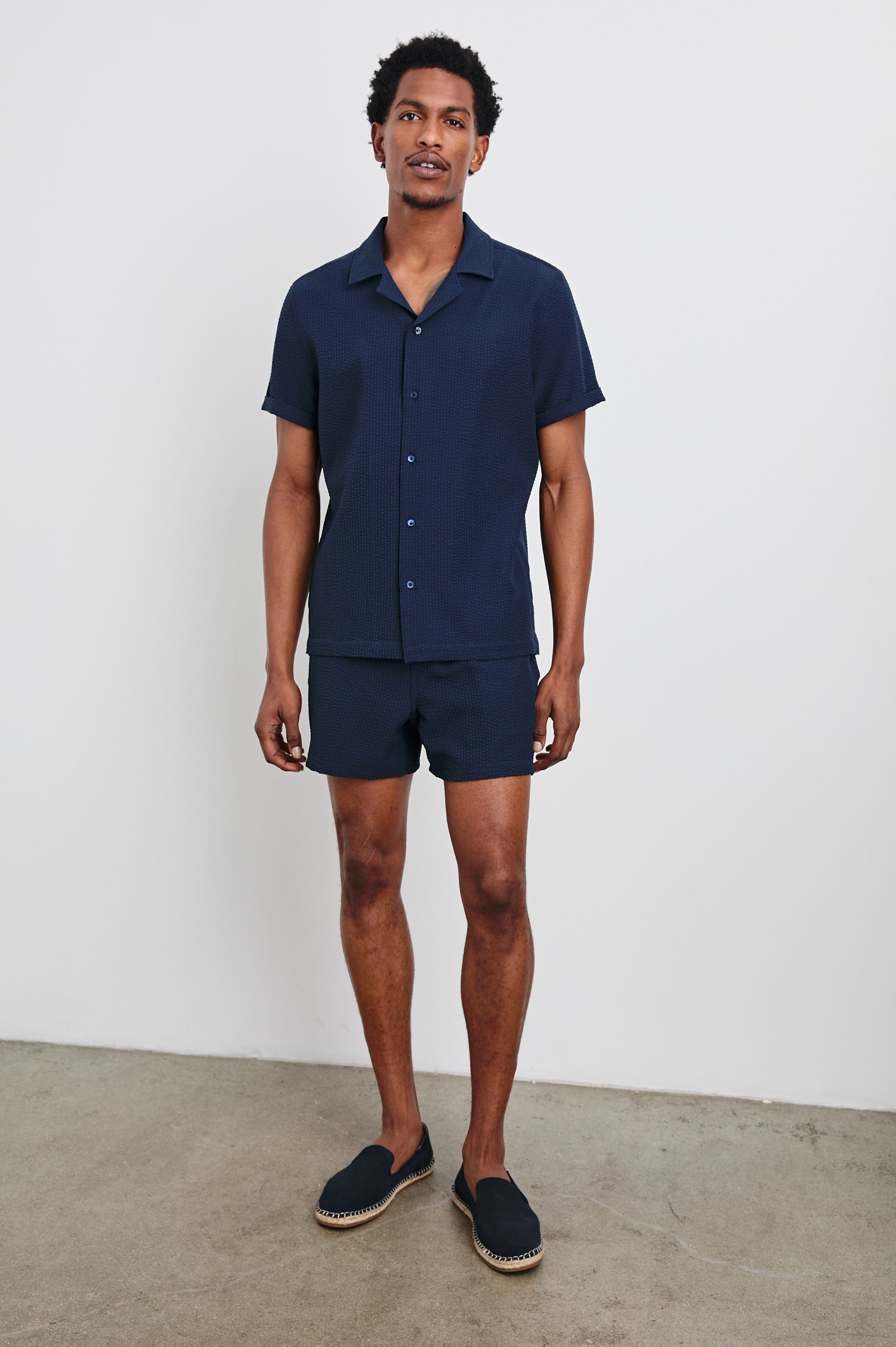 Amalfi Short-Sleeve Button Up in Navy Seersucker Colorway - Front Full Body View Featured on Model
