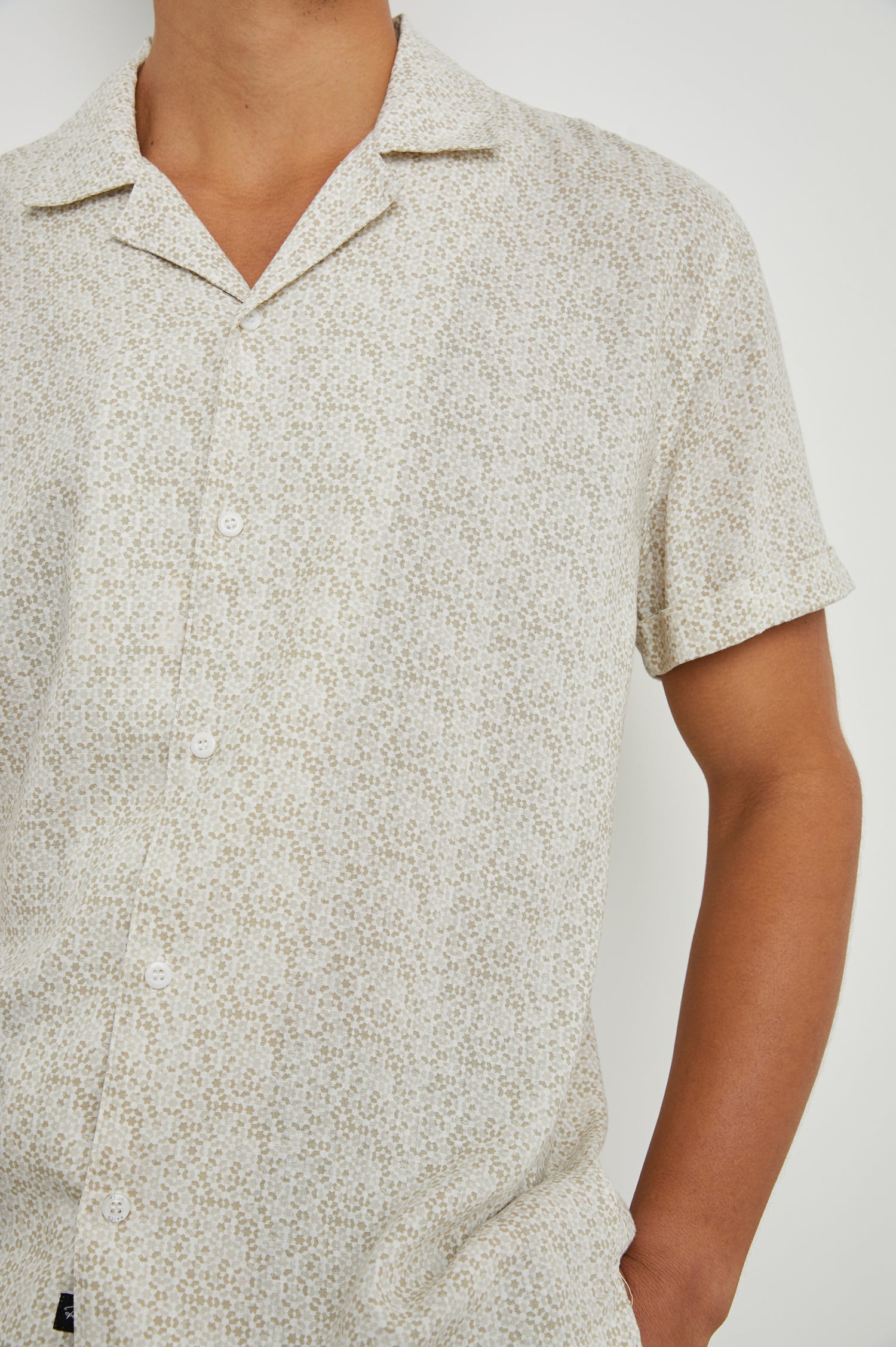 Amalfi Short-Sleeve Button Up in Painted Tile Khaki Colorway, geometric pattern in browns on khaki - Front View Featured on Model