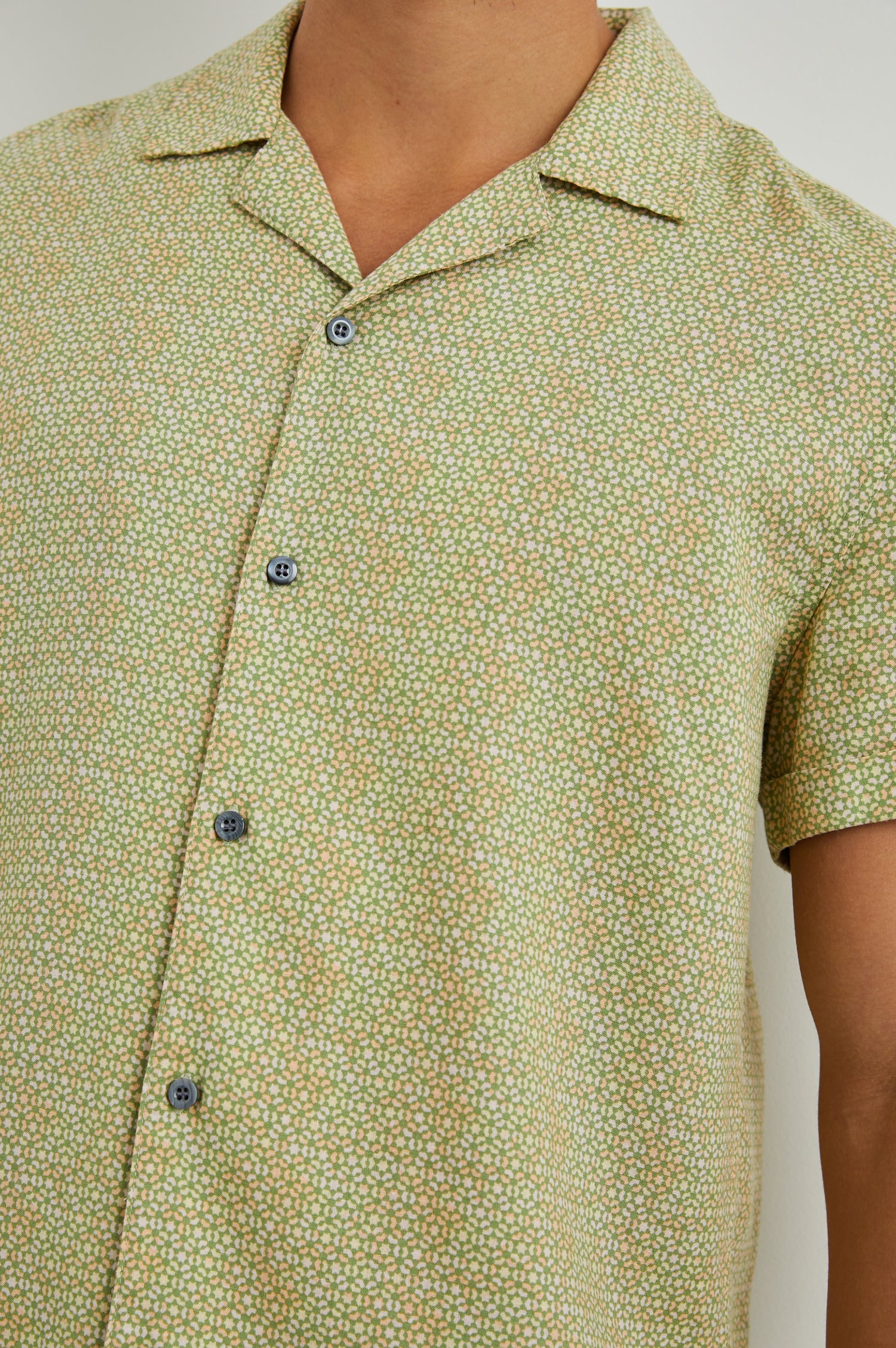 Amalfi Short-Sleeve Button Up in Painted Tile Matcha Colorway, green and peach geometric pattern on matcha  - Front View Featured on Model