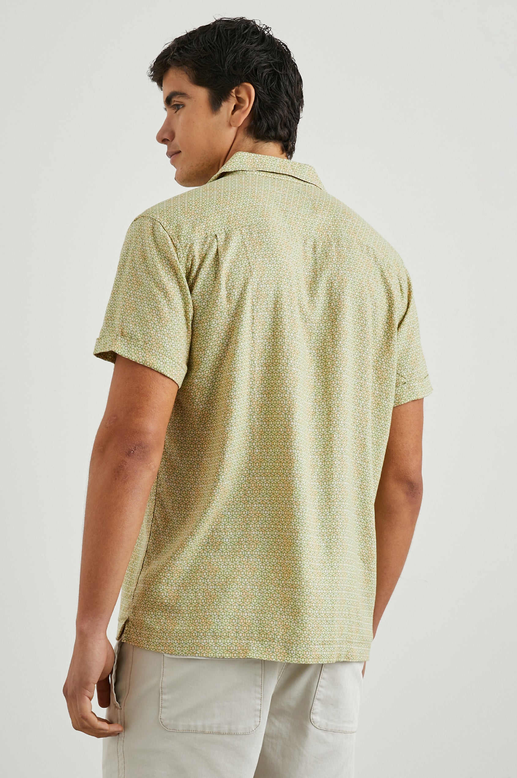 Amalfi Short-Sleeve Button Up in Painted Tile Matcha Colorway, green and peach geometric pattern on matcha  - Back View Featured on Model