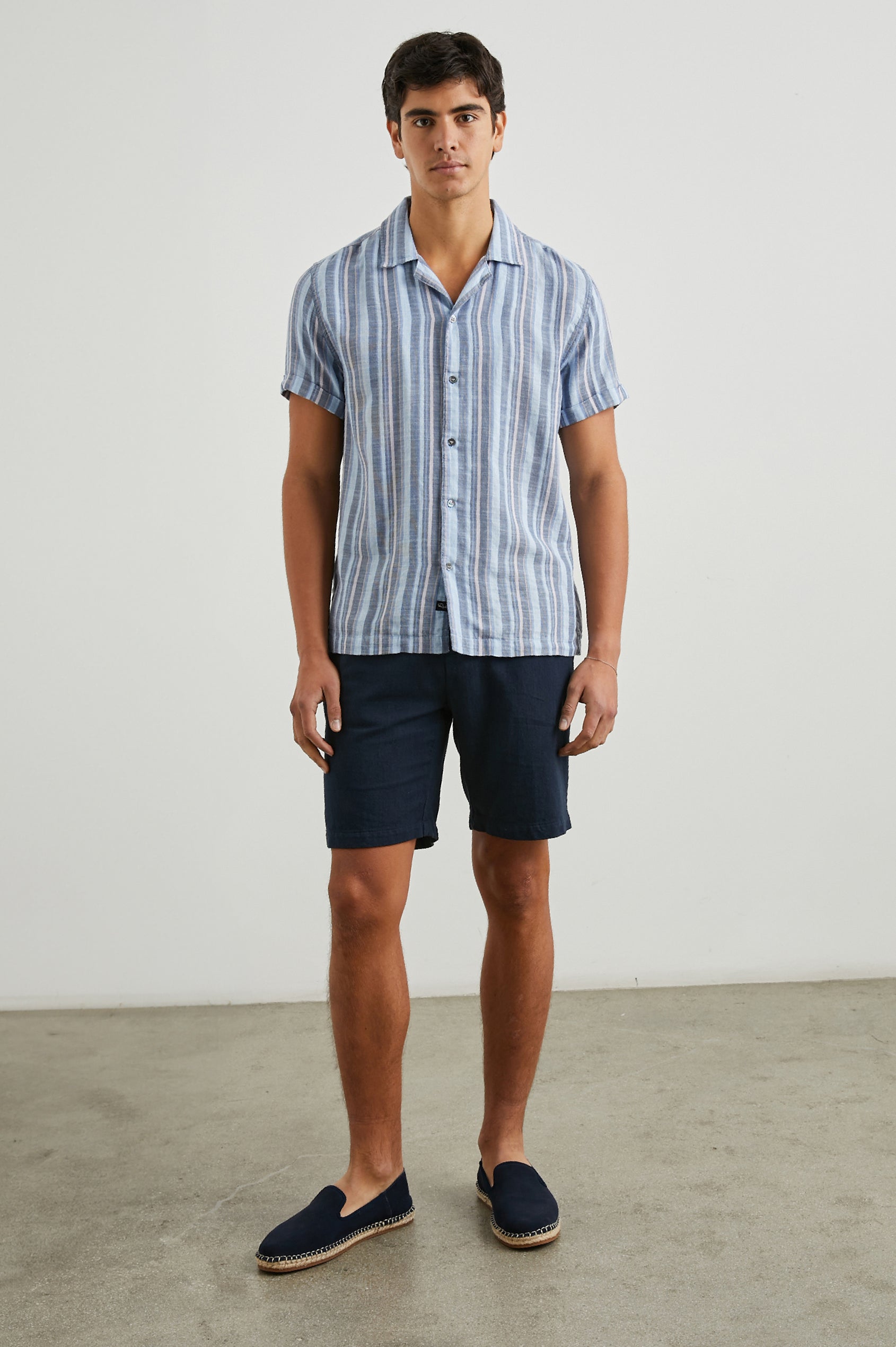 Amalfi Short-Sleeve Button Up in Powder Cobalt Stripe Colorway, vertical stripes in powder, cobalt and petal - Front Full Body View Featured on Model