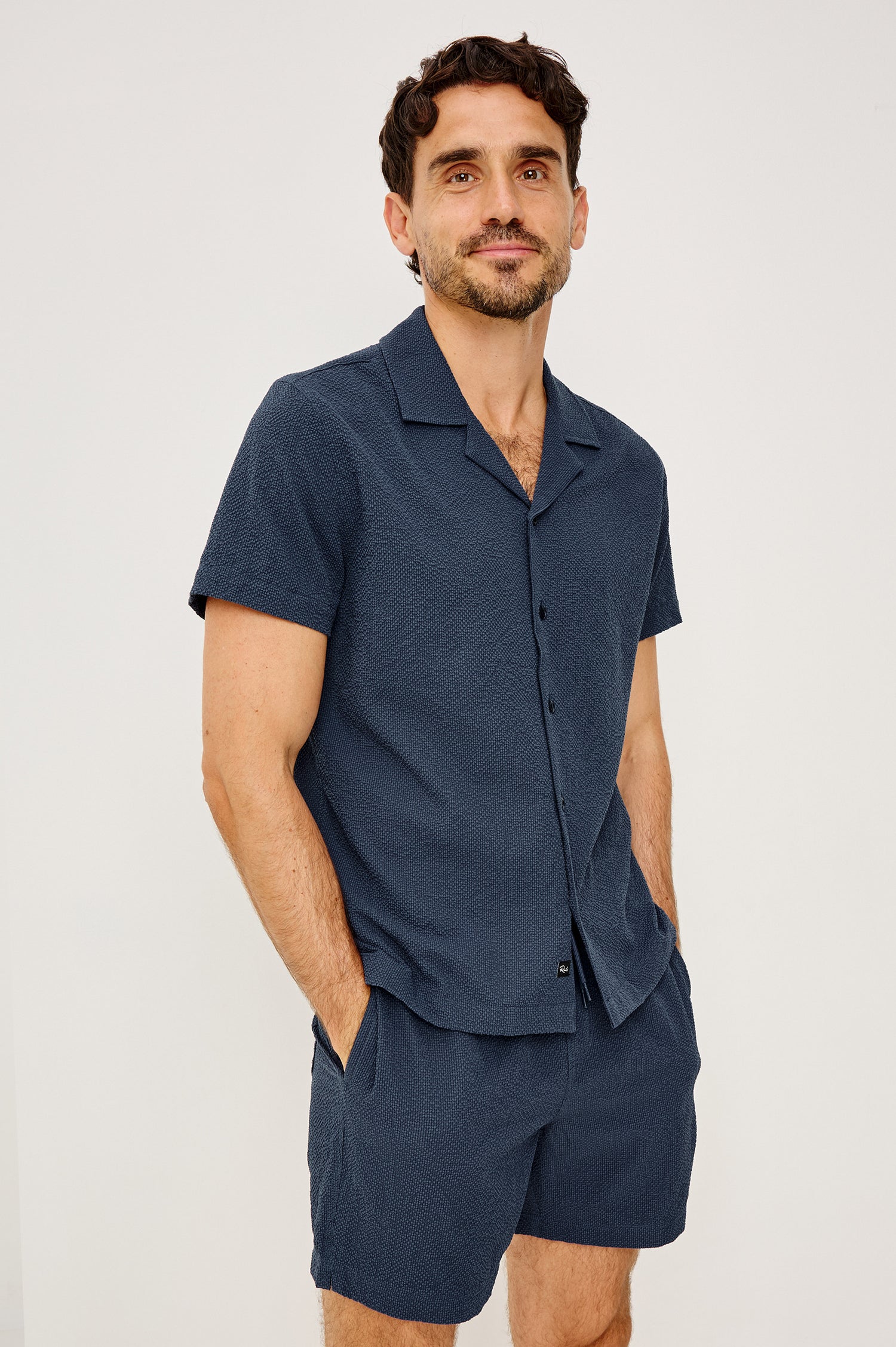 Amalfi Camp Shirt in Lightweight Seersucker With Notched Collar, Front Buttons, Short Sleeves, and Relaxed Fit in Stratos Colorway - Upper Body Front View Featured on Model
