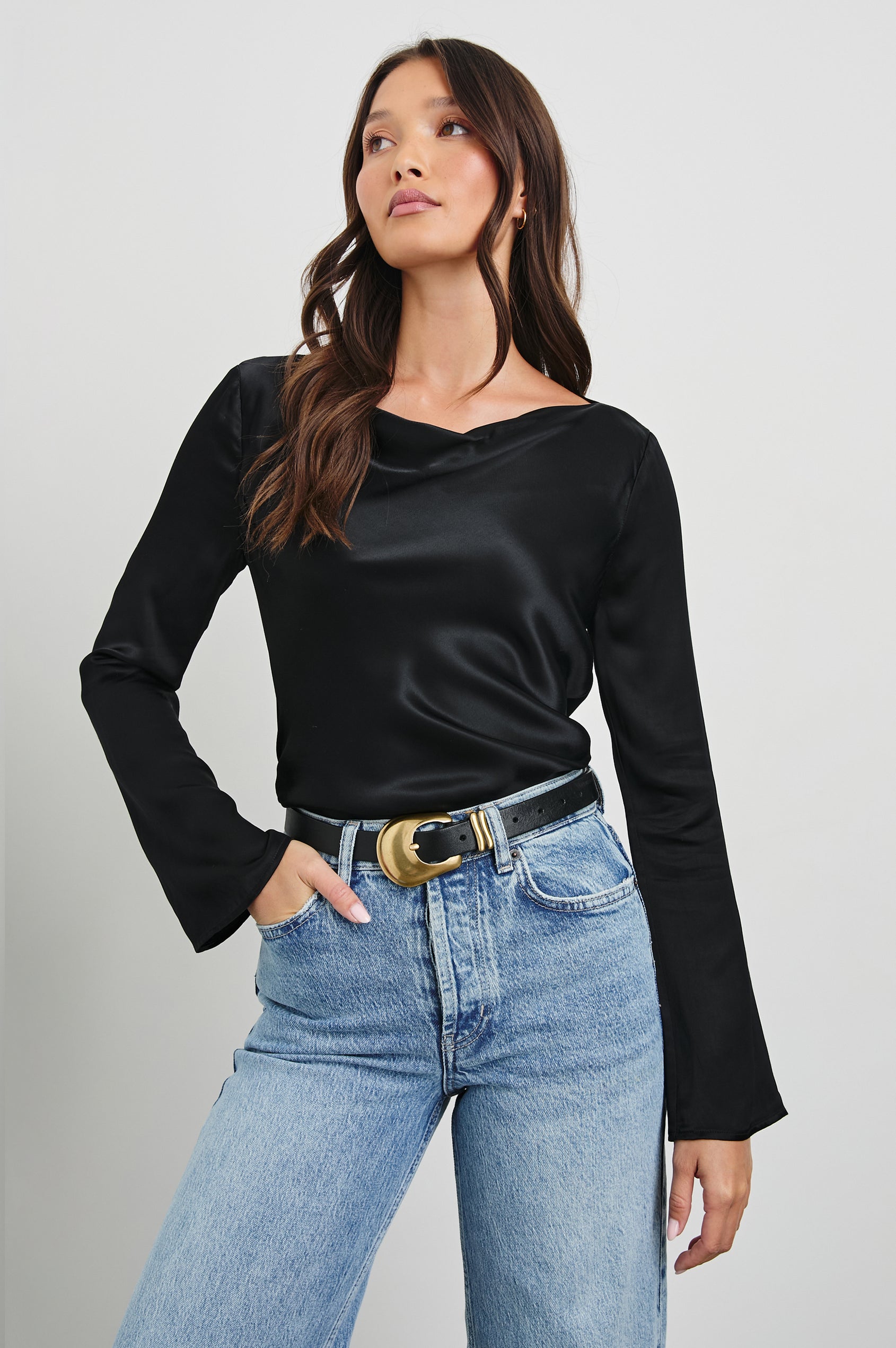 Amari Long-Sleeve Top with Boat Neckline and Flared Sleeves in Black Colorway - Front Tucked View Featured on Model