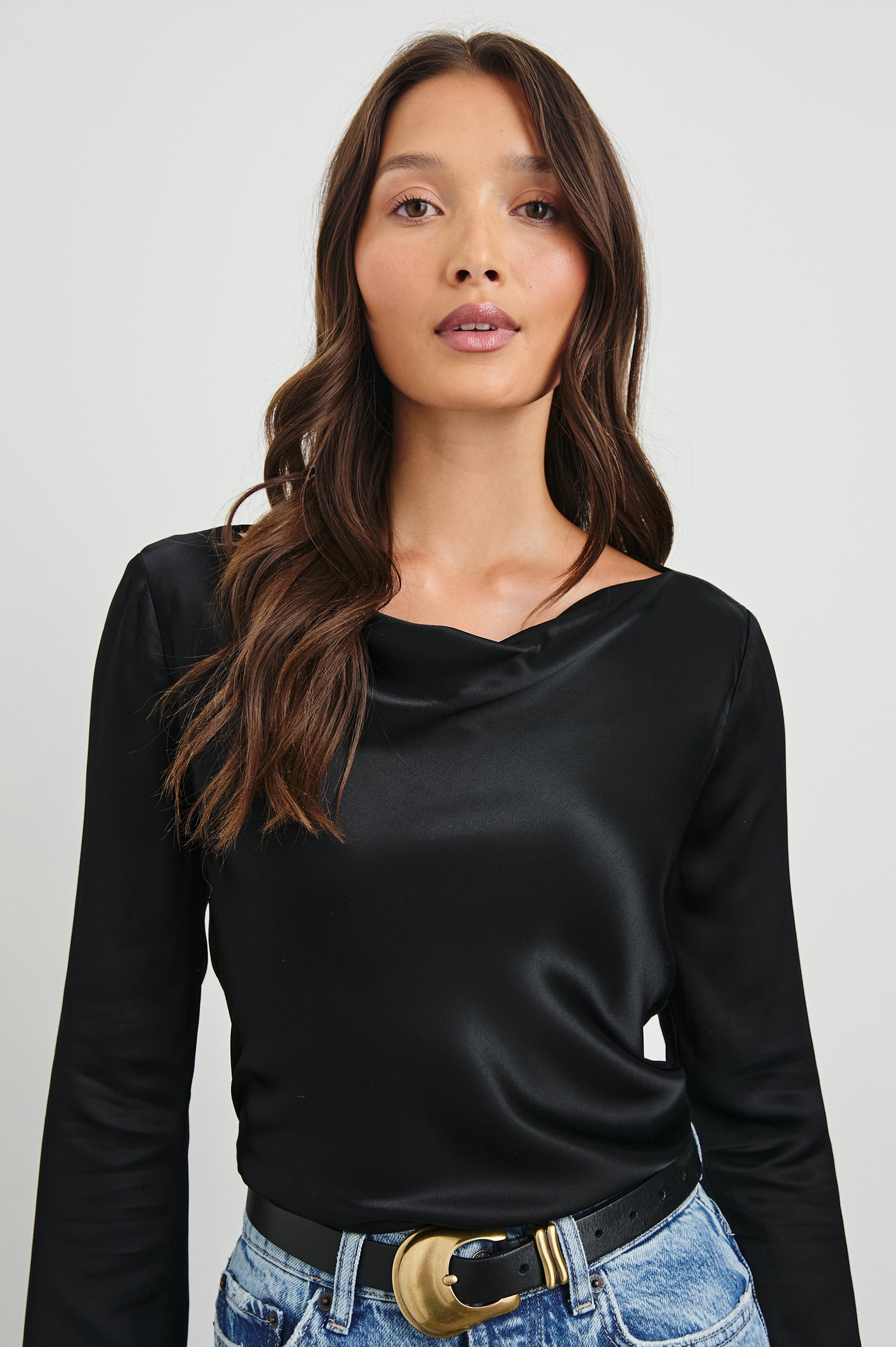 Amari Long-Sleeve Top with Boat Neckline and Flared Sleeves in Black Colorway - Front Tucked View Featured on Model