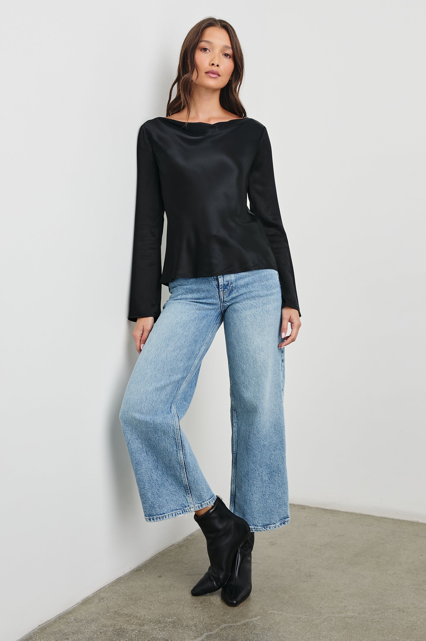 Amari Long-Sleeve Top with Boat Neckline and Flared Sleeves in Black Colorway - Front Full Body View Featured on Model