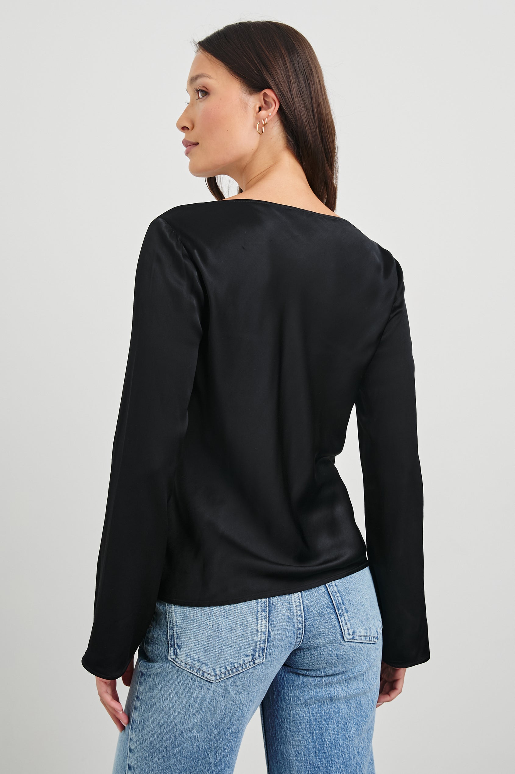 Amari Long-Sleeve Top with Boat Neckline and Flared Sleeves in Black Colorway - Back View Featured on Model