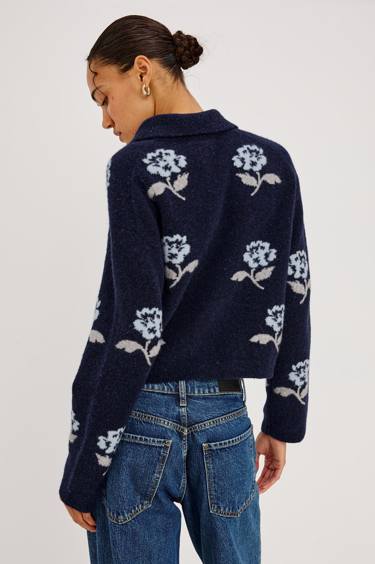 Amber Cardigan in Floral Jacquard Knit With Front Buttons, Point Collar, and Long Sleeves in Navy Petals Colorway - Upper Body Back View Featured on Model.