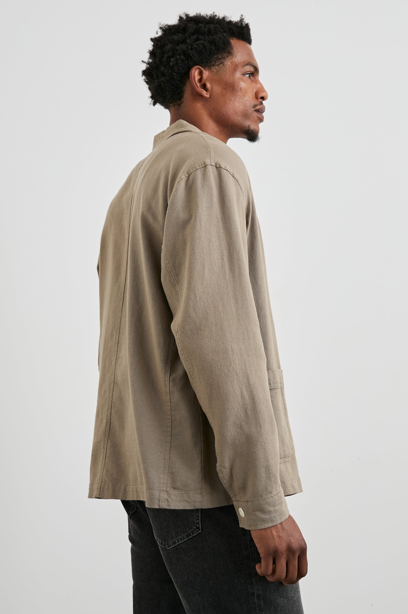 Ambrose Jacket with Button Closure and Three Front Patch Pockets in Barley Colorway - Side View Featured on Model