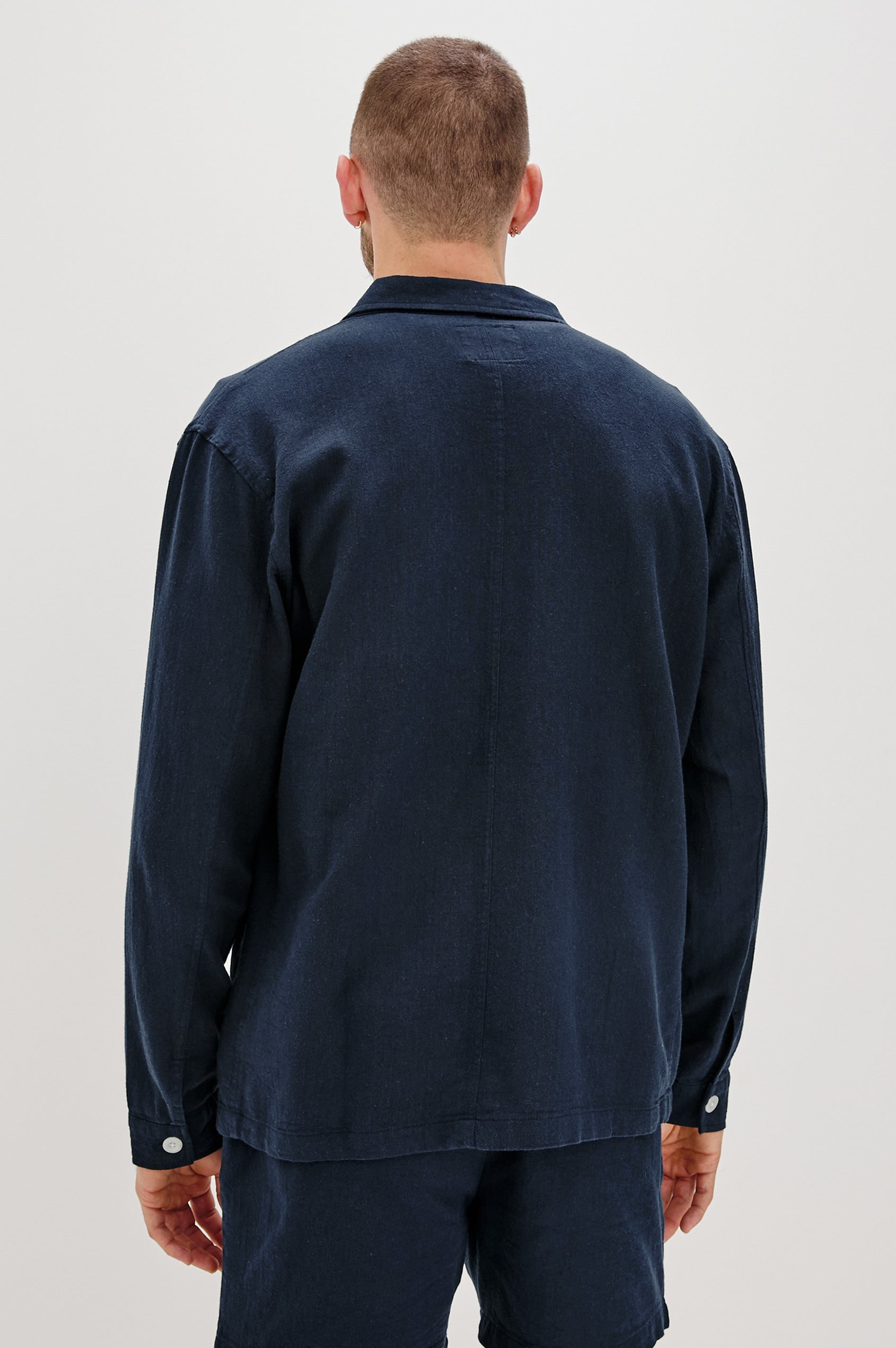 Ambrose Jacket with Button Closure and Two Front Patch Pockets and a Chest Patch Pocket in Deep Meridian Colorway - Back View Featured on Model