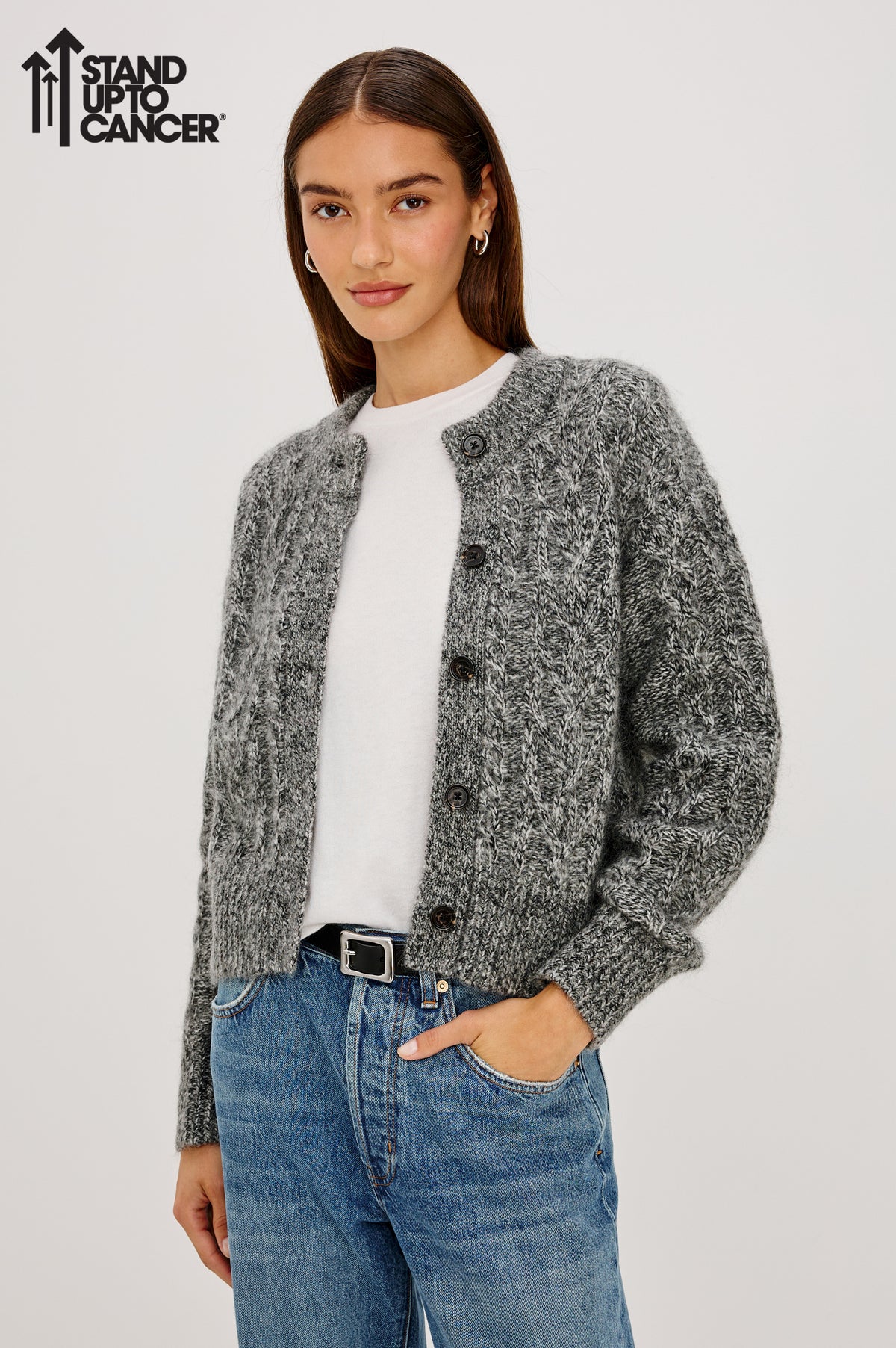 Amelie Cardigan in Cable Knit Wool-Cotton Blend, Crewneck, and Front Button Closure in Grey Colorway with Stand Up To Cancer Logo - Upper Body Front View Featured on Model