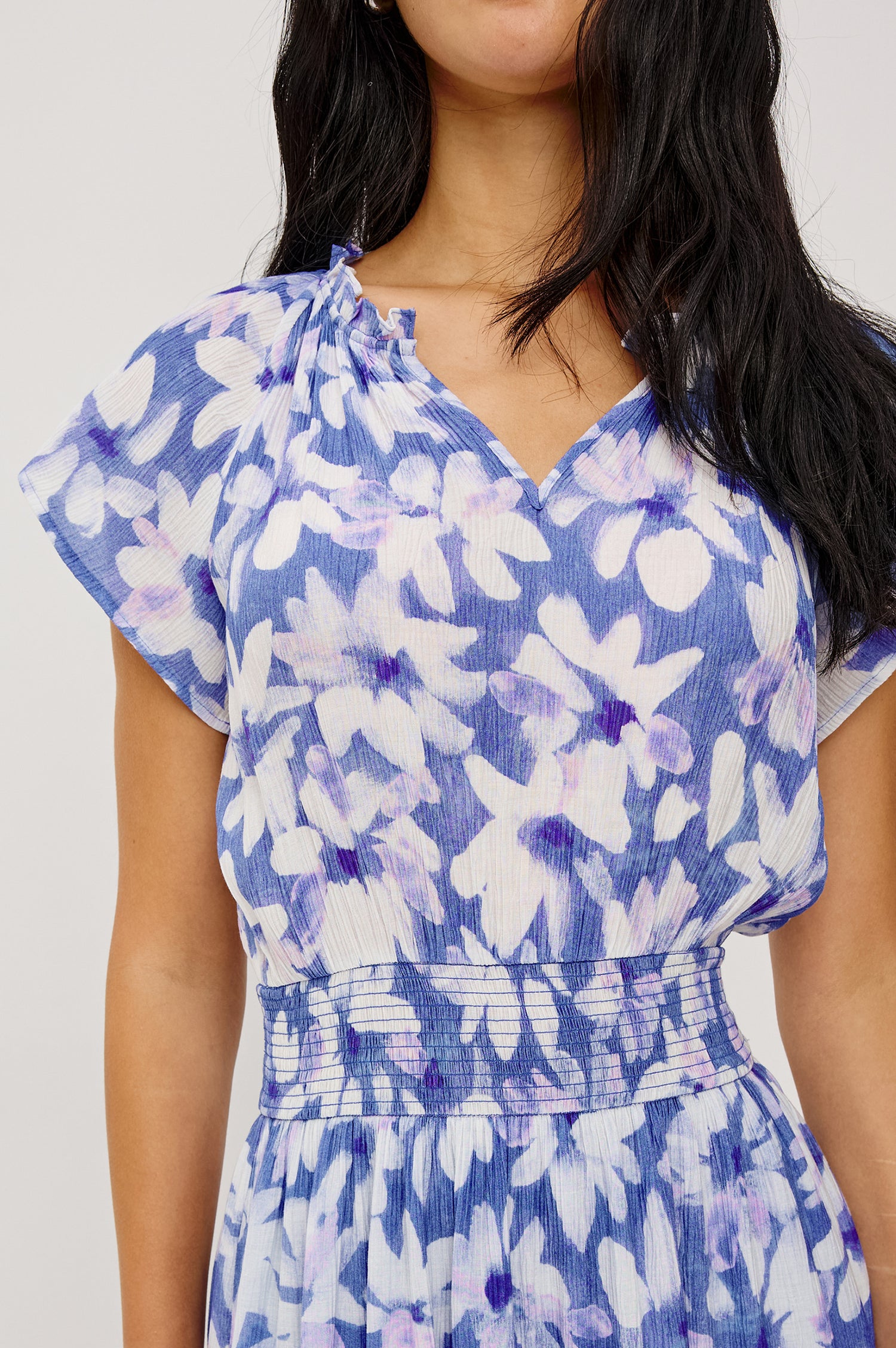 Amellia Midi Dress in Chiffon With Ruffled Split V-Neckline Flutter Sleeves a Smocked Waist and Tiered A-Line Skirt in Blue Ameranth Colorway - Upper Body Close Up Front View Featured on Model