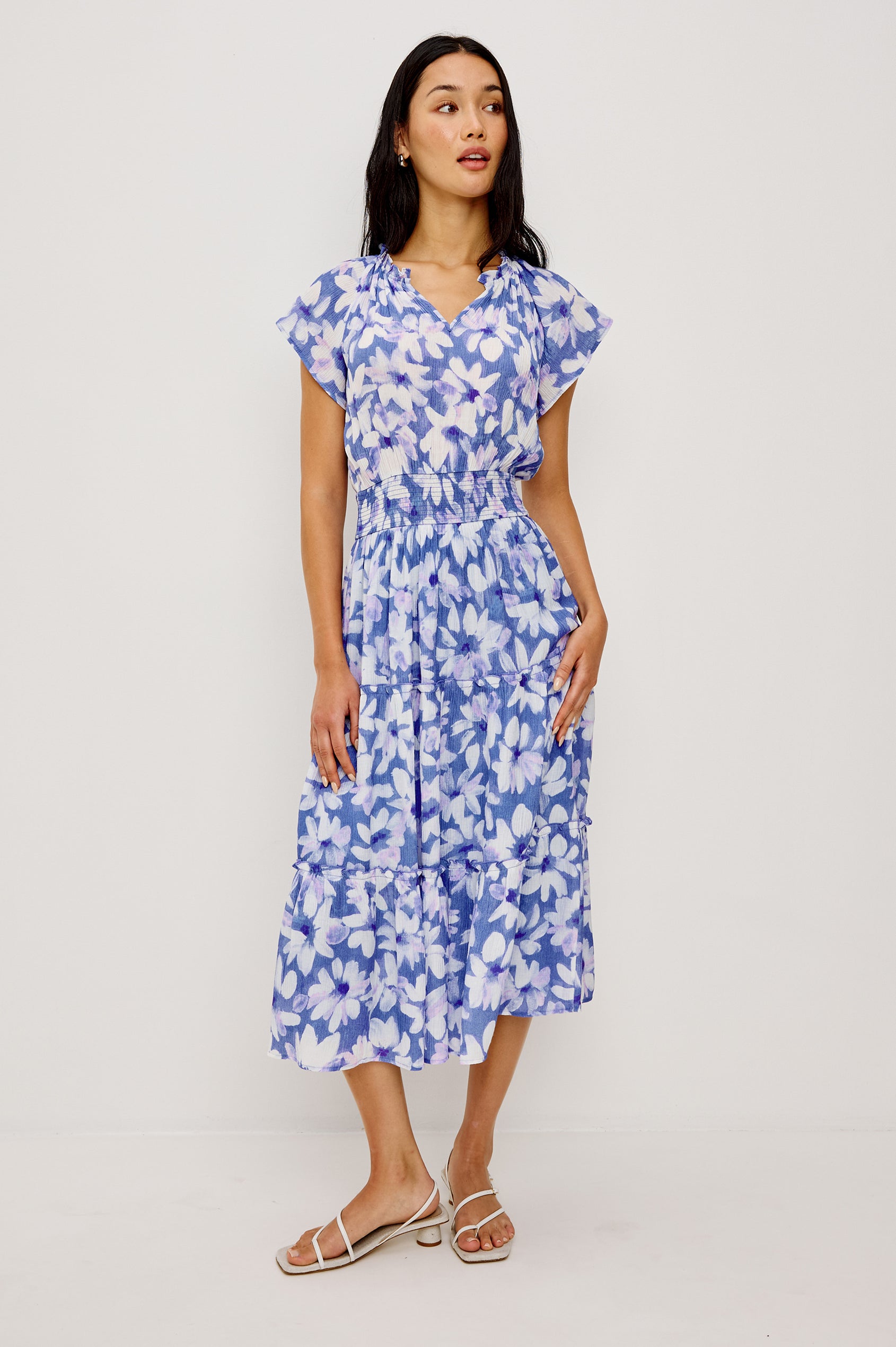 Amellia Midi Dress in Chiffon With Ruffled Split V-Neckline Flutter Sleeves a Smocked Waist and Tiered A-Line Skirt in Blue Ameranth Colorway - Full Body Front View Featured on Model