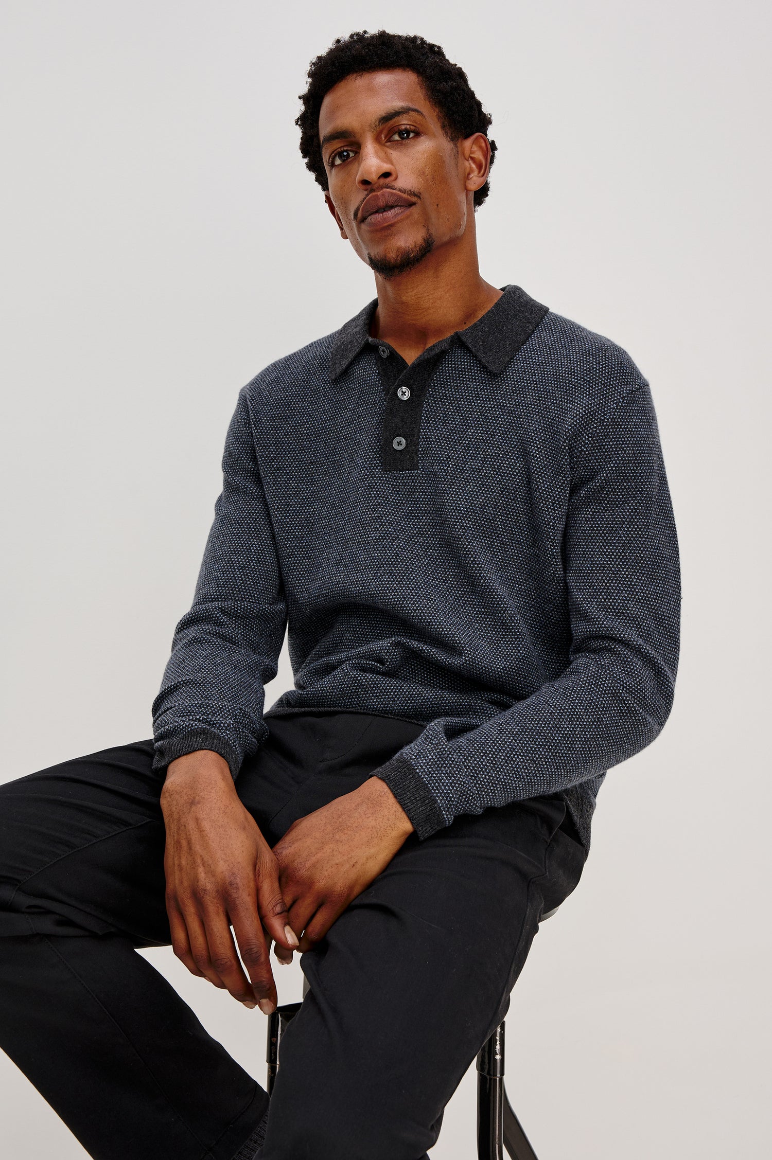 Anders Long Sleeve 3-Button Polo with Contrast Collar, Button Placket, Hem and Cuffs in Navy Blue Colorway. Front Seated View Featured on Model.
